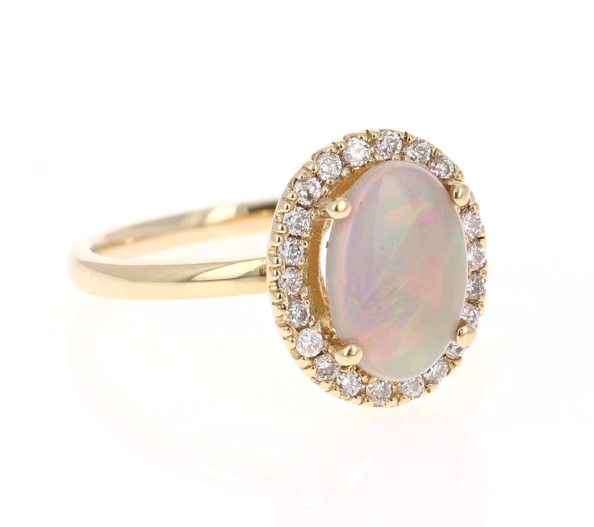 This ring has a cute and simple 1.03 Carat Opal and has 22 Round Cut Diamonds that weigh 0.25 Carats. The total carat weight of the ring is 1.28 Carats. 

The Opal displays beautiful flashes of green, yellow, and orange and has its origins from