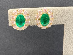 1.28 Carat Oval Cut Emerald and Diamond Stud Earrings in 18K Yellow Gold