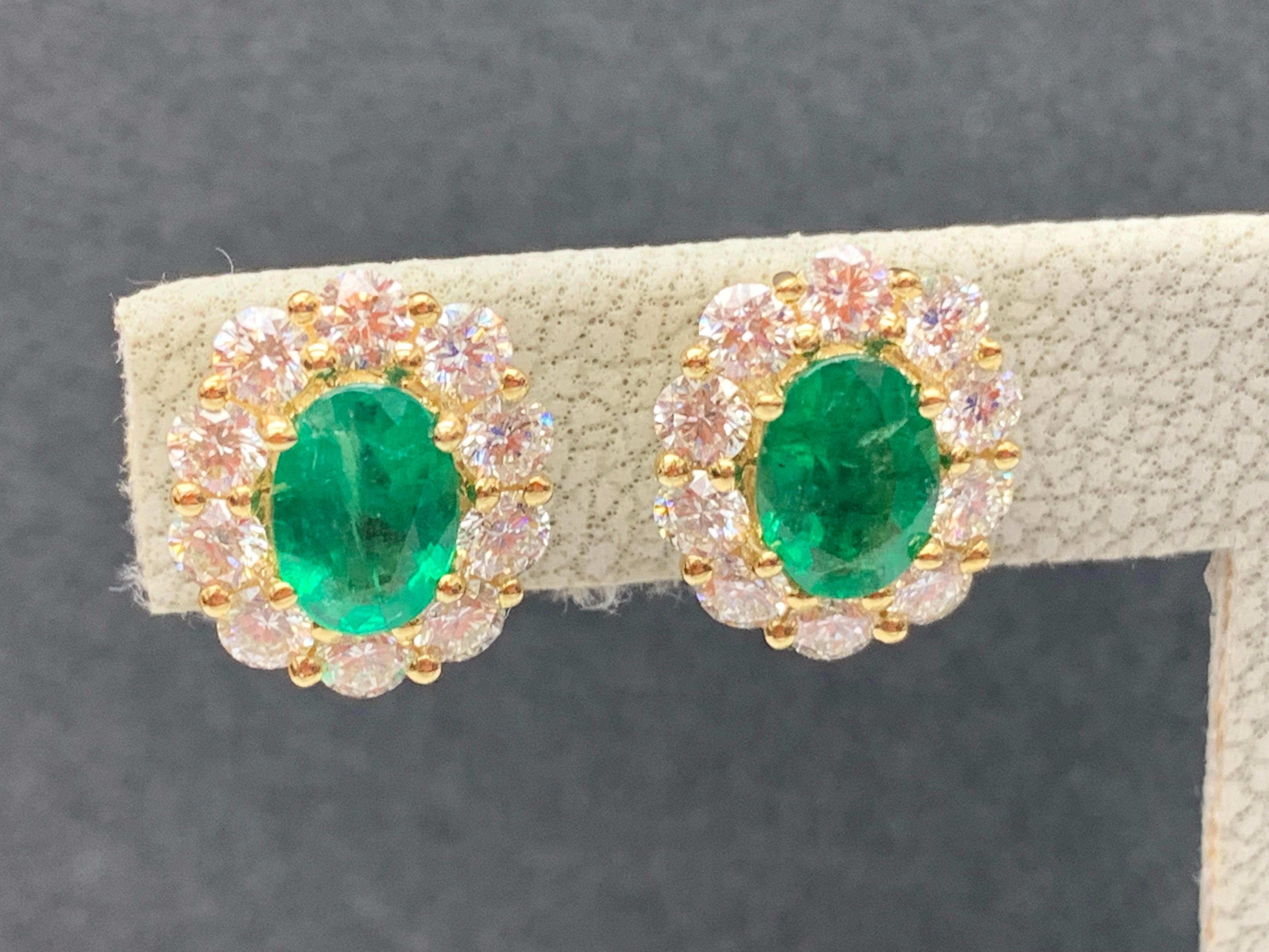 Contemporary 1.28 Carat Oval Cut Emerald and Diamond Stud Earrings in 18K Yellow Gold For Sale