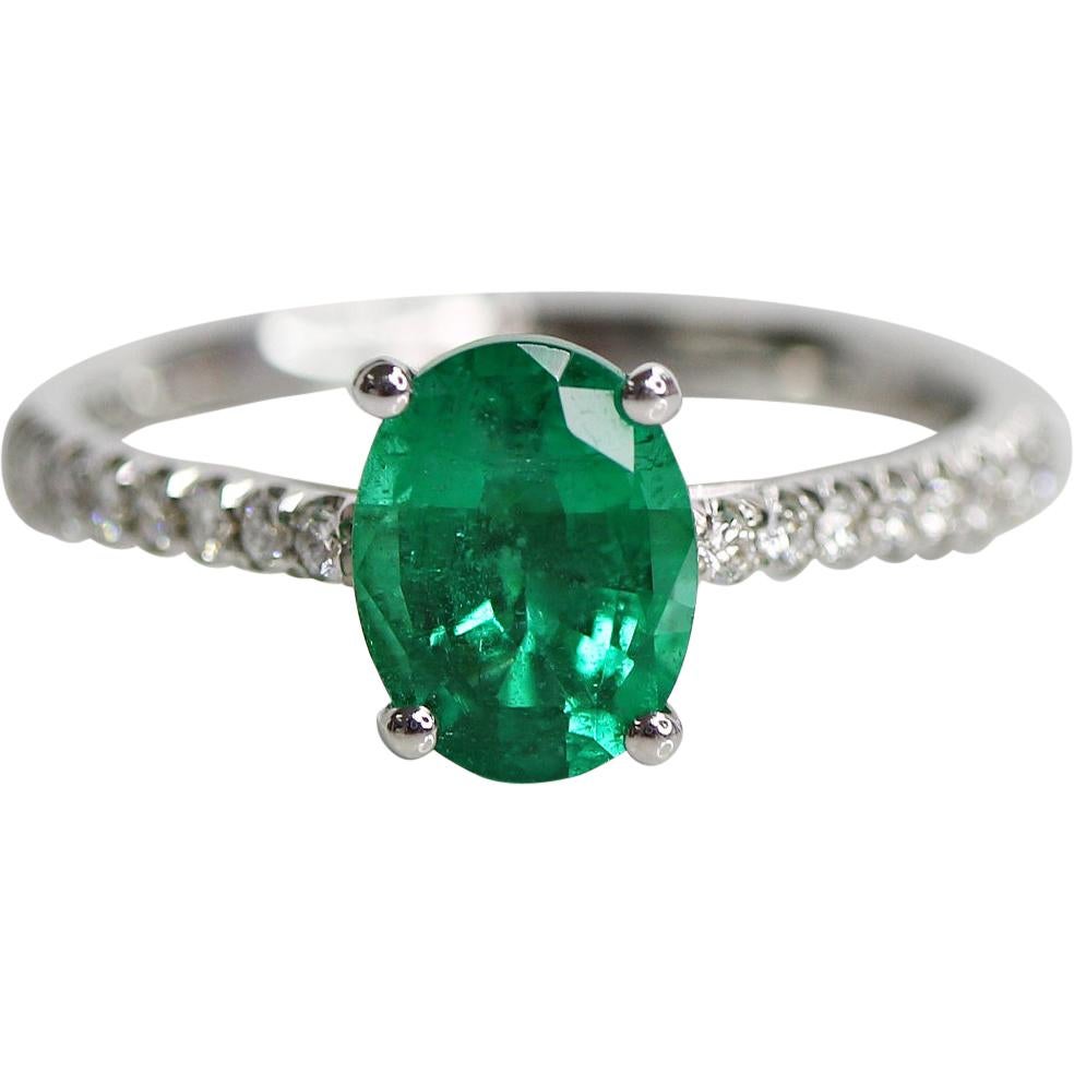 1.28 Carat OVal Cut Green Emerald and Diamond Ring For Sale
