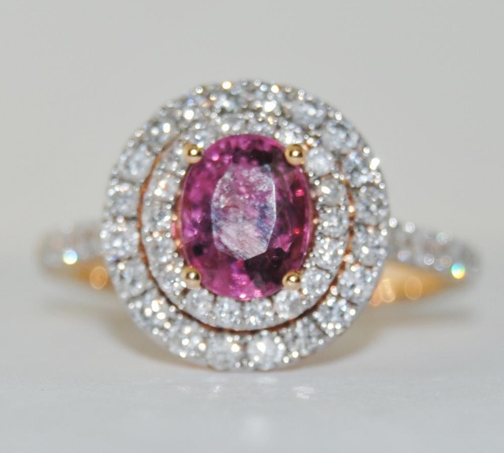 18K rose gold cocktail ring featuring 1.28 carat oval pink Spinel surrounded by 0.85 carats of round brilliant white Diamonds.  New ring, size 7   