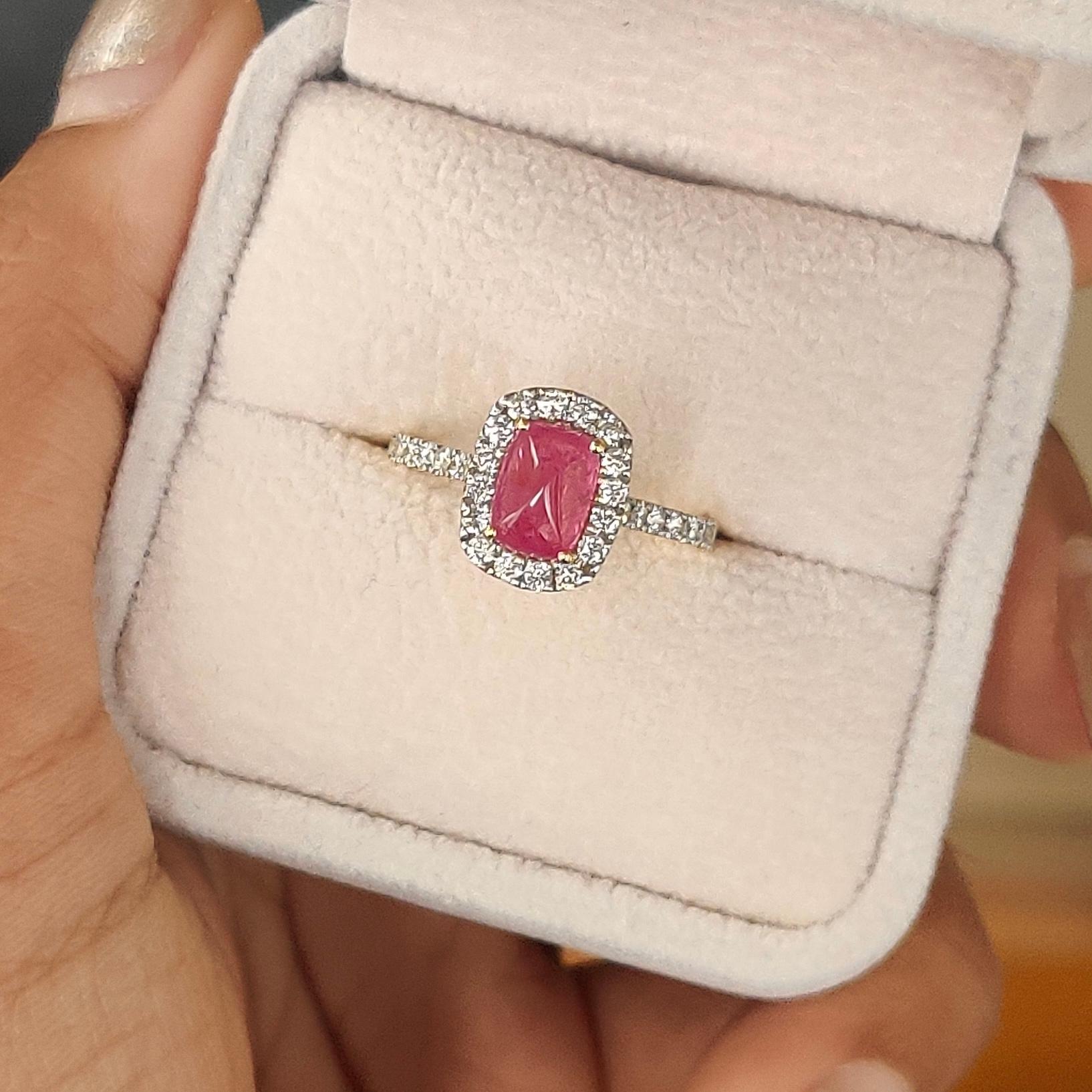 Radiating timeless elegance, this extraordinary piece has been specially designed to accentuate the mesmerizing beauty of this mesmerizing pink ruby. 

The ruby, a regal emblem of rich sophistication, boasts a captivating vivid pink hue and a total