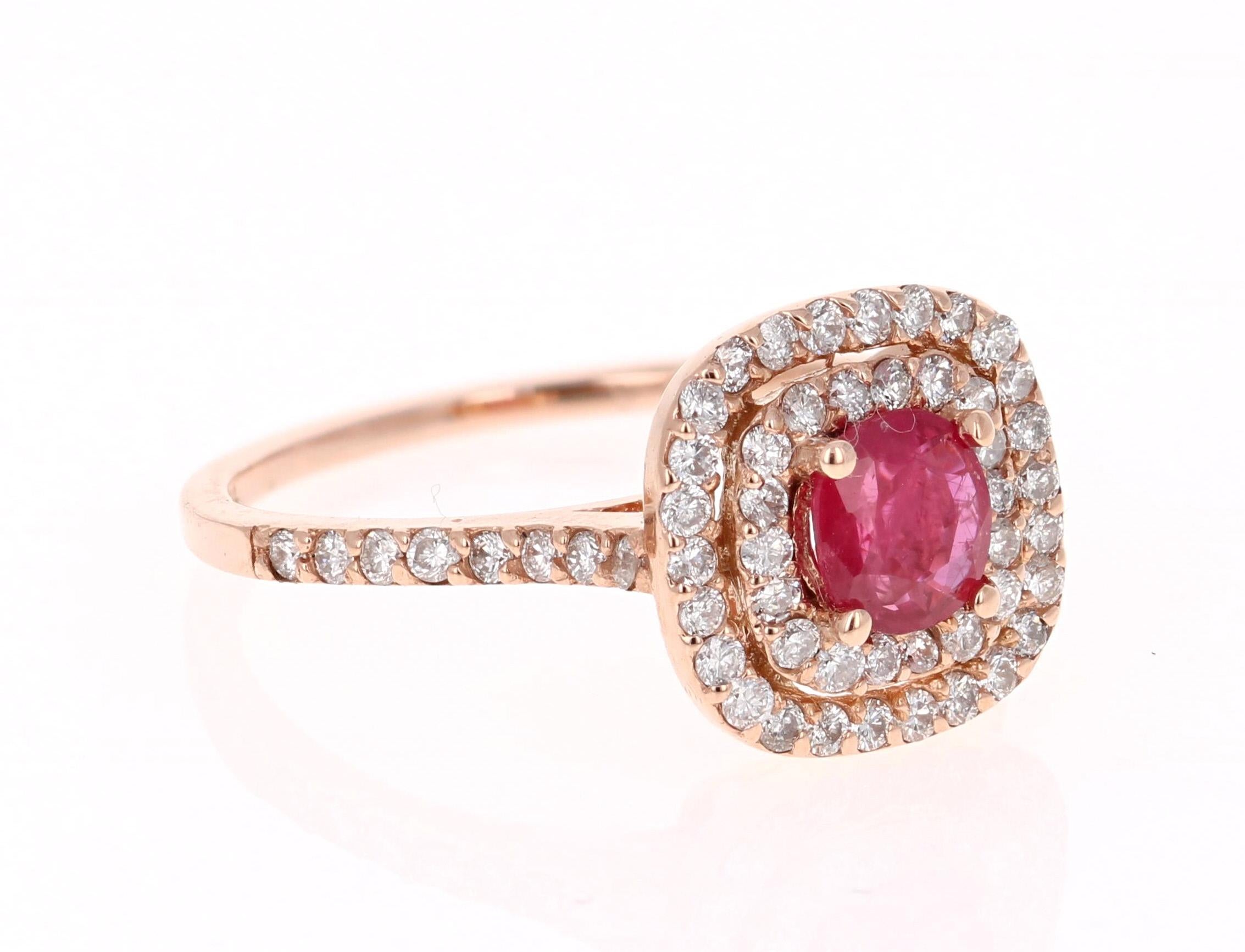 Simply beautiful Ruby Diamond Ring with a Round Cut 0.68 Carat Burmese Ruby which is surrounded by a double halo of 62 Round Cut Diamonds that weigh 0.60 carats. The total carat weight of the ring is 1.28 carats. The clarity and color of the