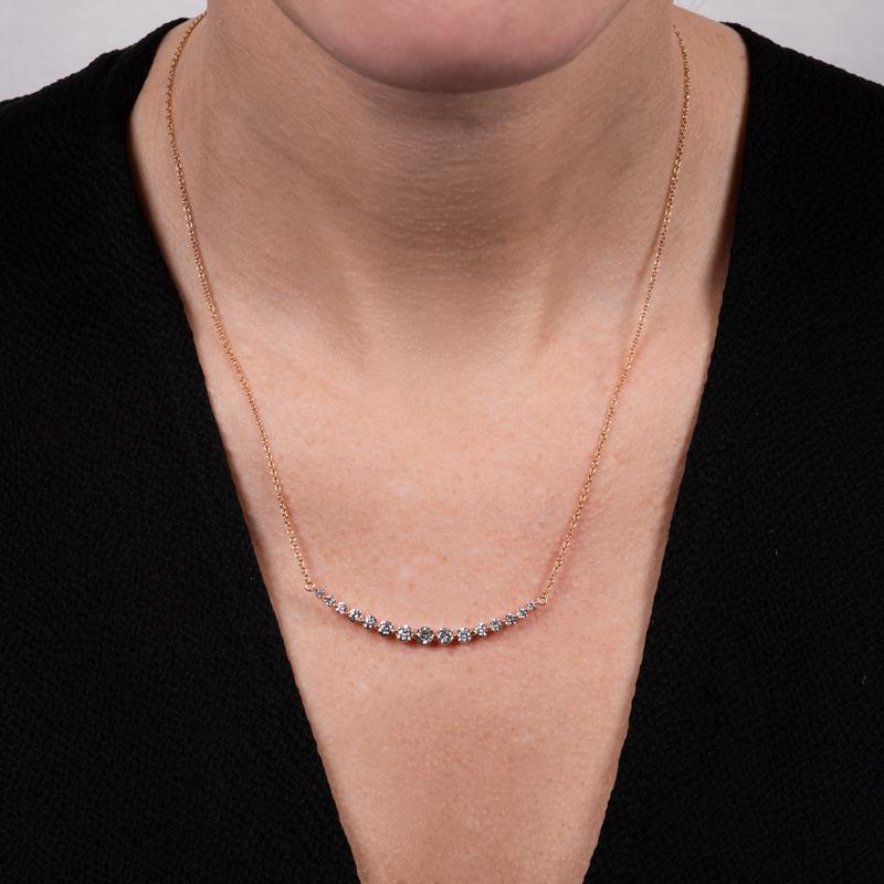This necklace features 1.28 carat total weight in graduated natural round diamonds set in 18 karat rose gold.  It is set on an 18 karat rose gold chain. Chain measures 18
