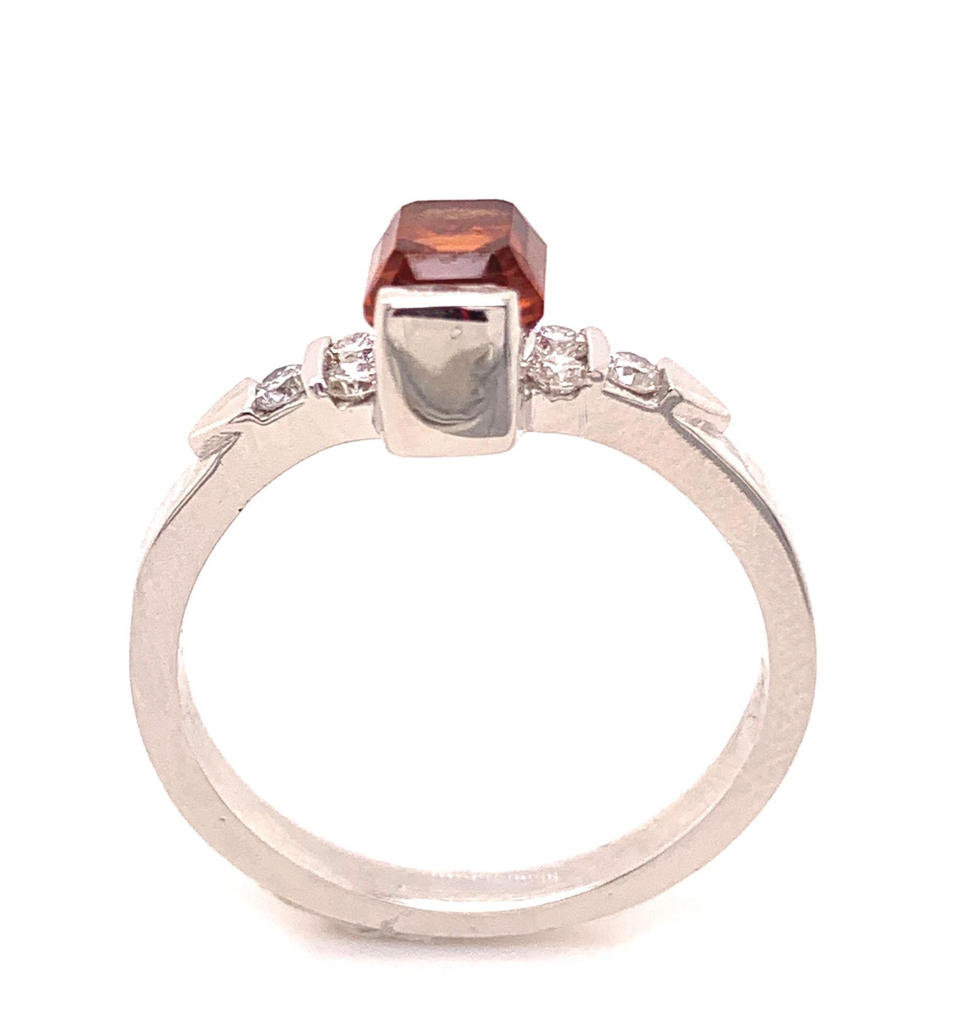 The State of California has been blessed with numerous gemstone deposits. 
This 14-karate white gold and Diamond ring contains one of the more unusual California gems, a Spessartite Garnet from Ramona located in Southern California close to San