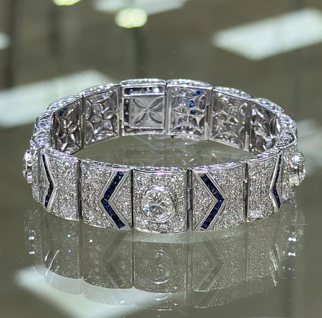 This bracelet is fit for a queen. 
Absolutely stunning white and blue sapphire diamond jewelry design that sparkles beautifully. It is made up of platinum.
Metal: Platinum
Diamond Weigh 308: 12.80ctw
Sapphire Weight 90: 3.37ctw
Bracelet Width: