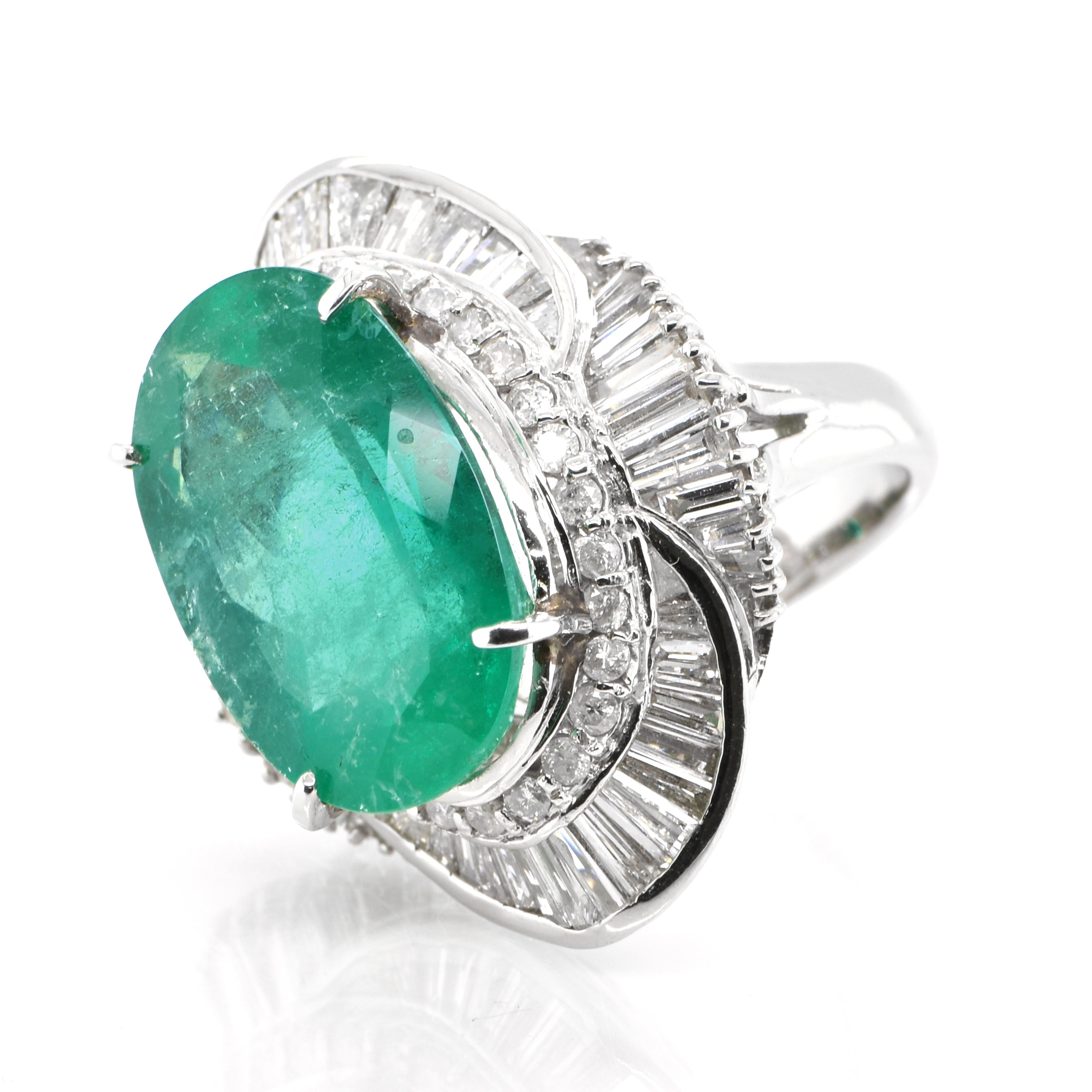 A stunning ring featuring a 12.81 Carat Natural Emerald and 2.72 Carats of Diamond Accents set in Platinum. People have admired emerald’s green for thousands of years. Emeralds have always been associated with the lushest landscapes and the richest