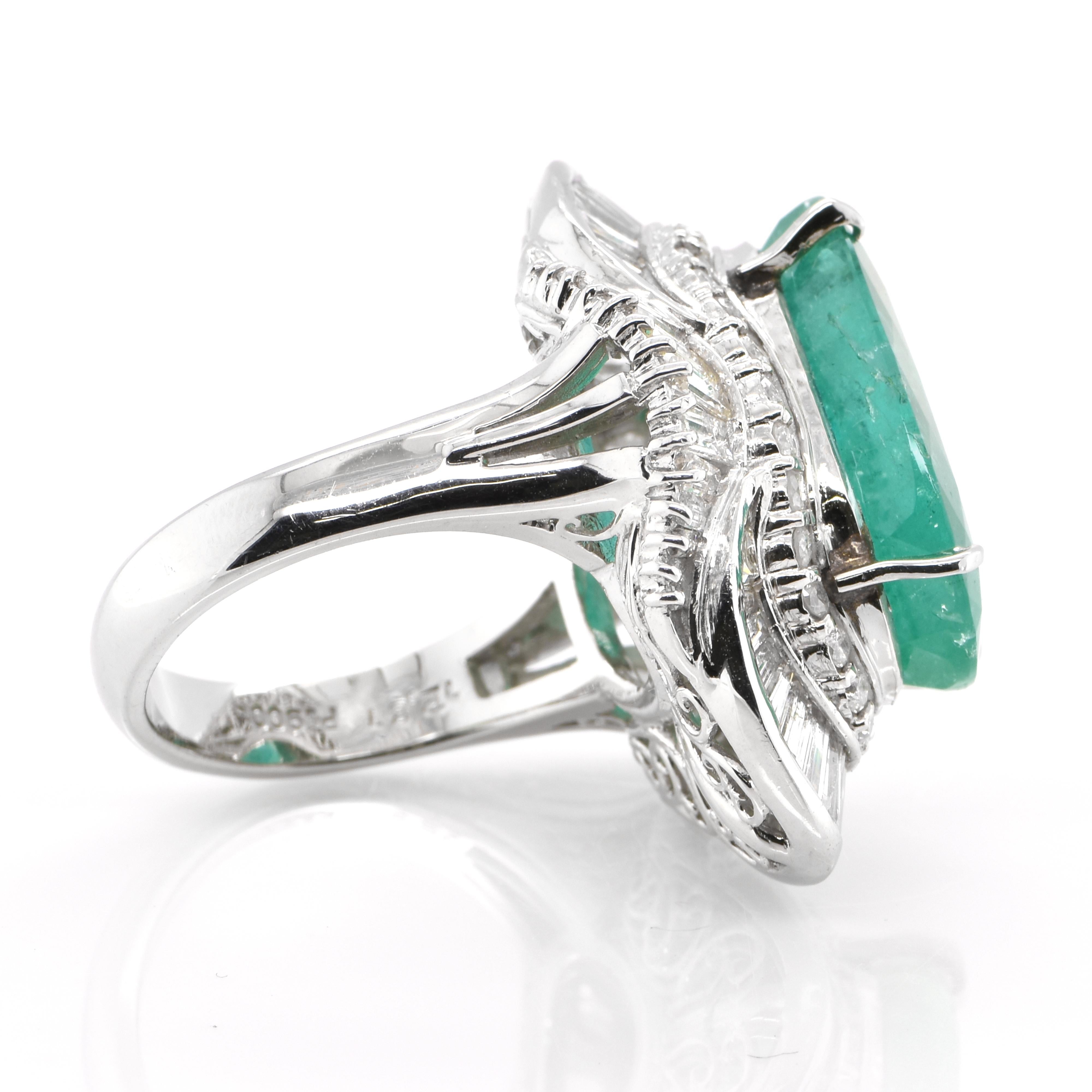 Oval Cut 12.81 Carat Natural Emerald and Diamond Ballerina Ring Set in Platinum