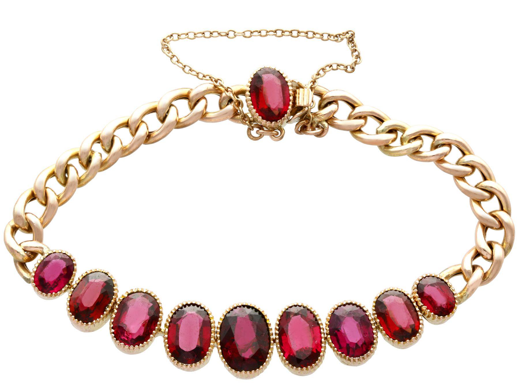 A fine and impressive antique bracelet in 9 karat yellow gold, embellished with 12.84 carat garnets; part of our bangle and bracelet collection.

This fine and impressive antique oval cut garnet bracelet has been crafted in 9k yellow gold.

The