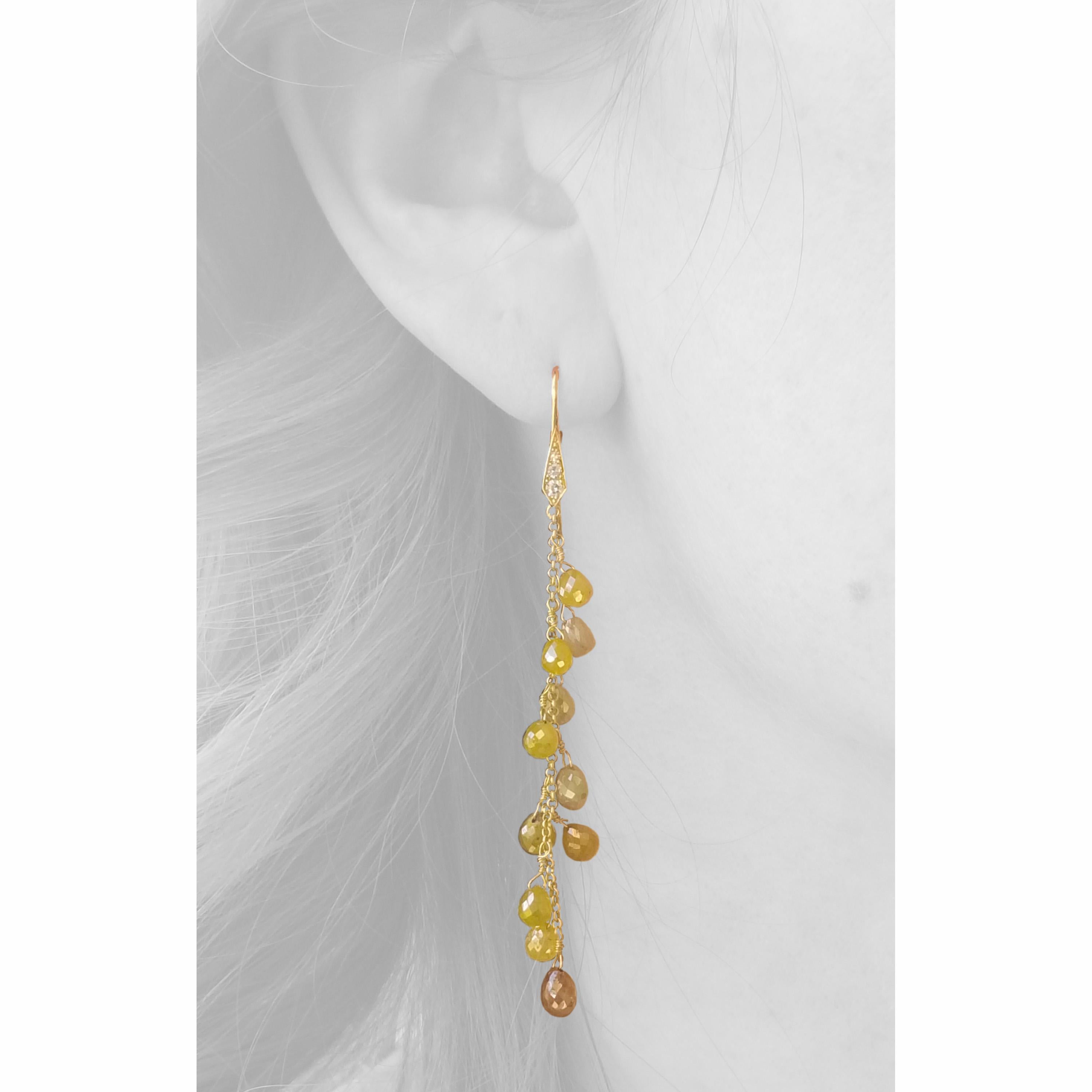 These earrings are an extraordinarily fun way to wear diamonds; they move and play nonstop, so the slim line of diamonds are extremely high impact. The unique metallic luster that you see in these translucent 