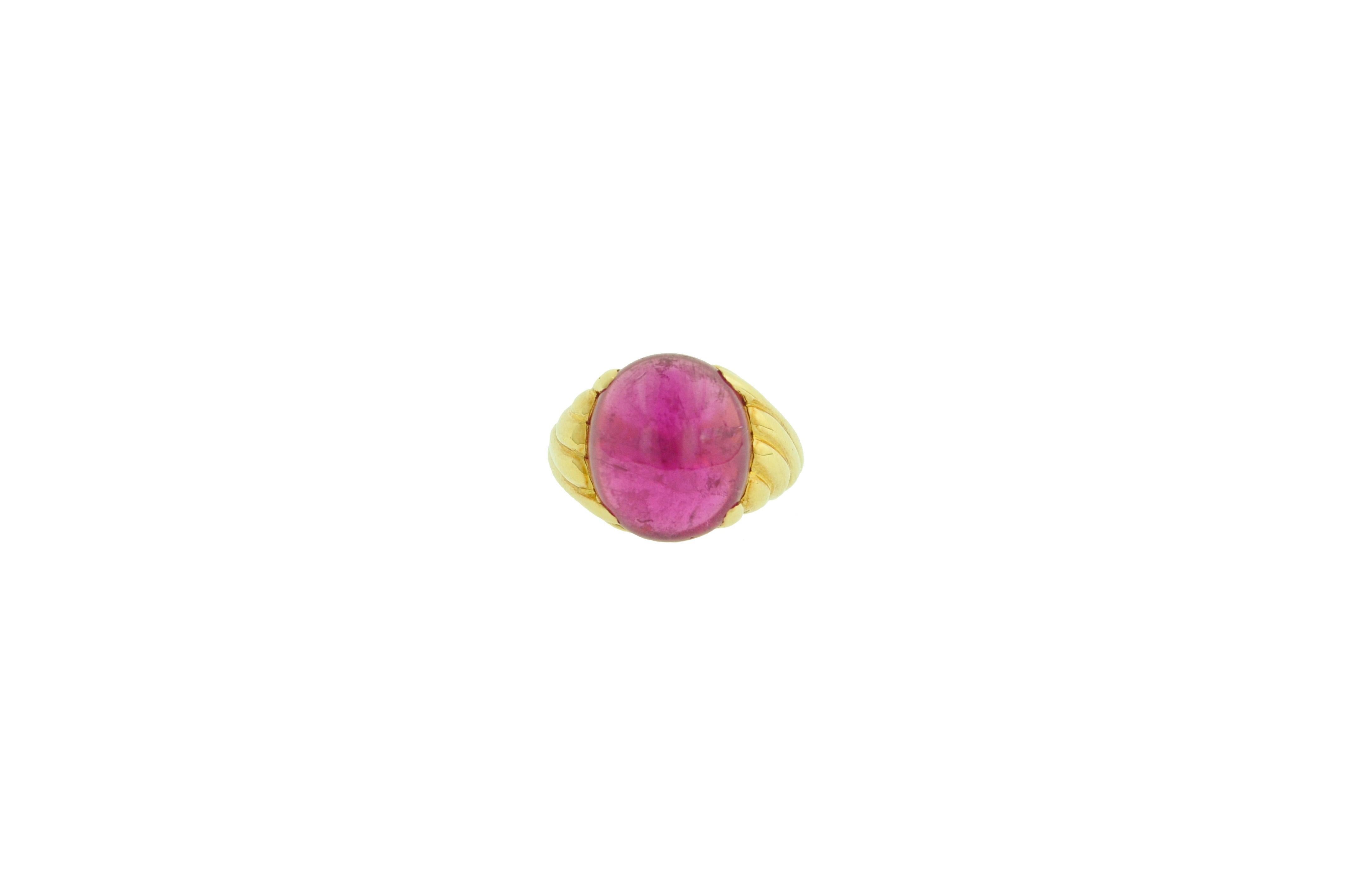 Crafted in 18 Karat Yellow Gold.

The cabochon rubellite weighs 12.87 carats.

Ringe size: 7 3/4