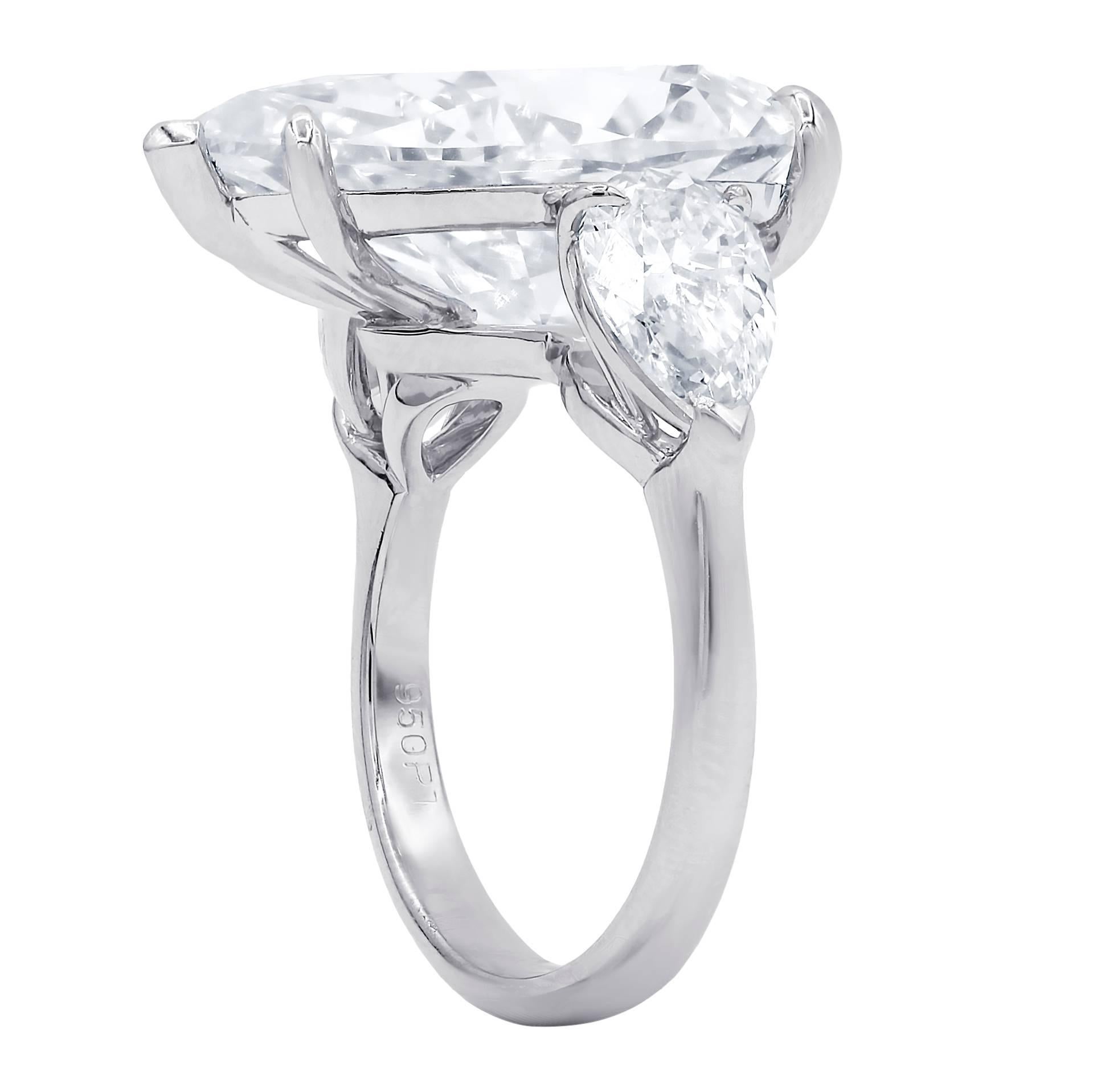Custom designed diamond ring consisting of center GIA certified pear cut diamond weighing 10.87 carats J/VS2  and accented by  two  GIA certified pear cut  diamonds on each side, weighing 1.00 carat J/VS2 and 1.01 carats J/VS2 set in platinum