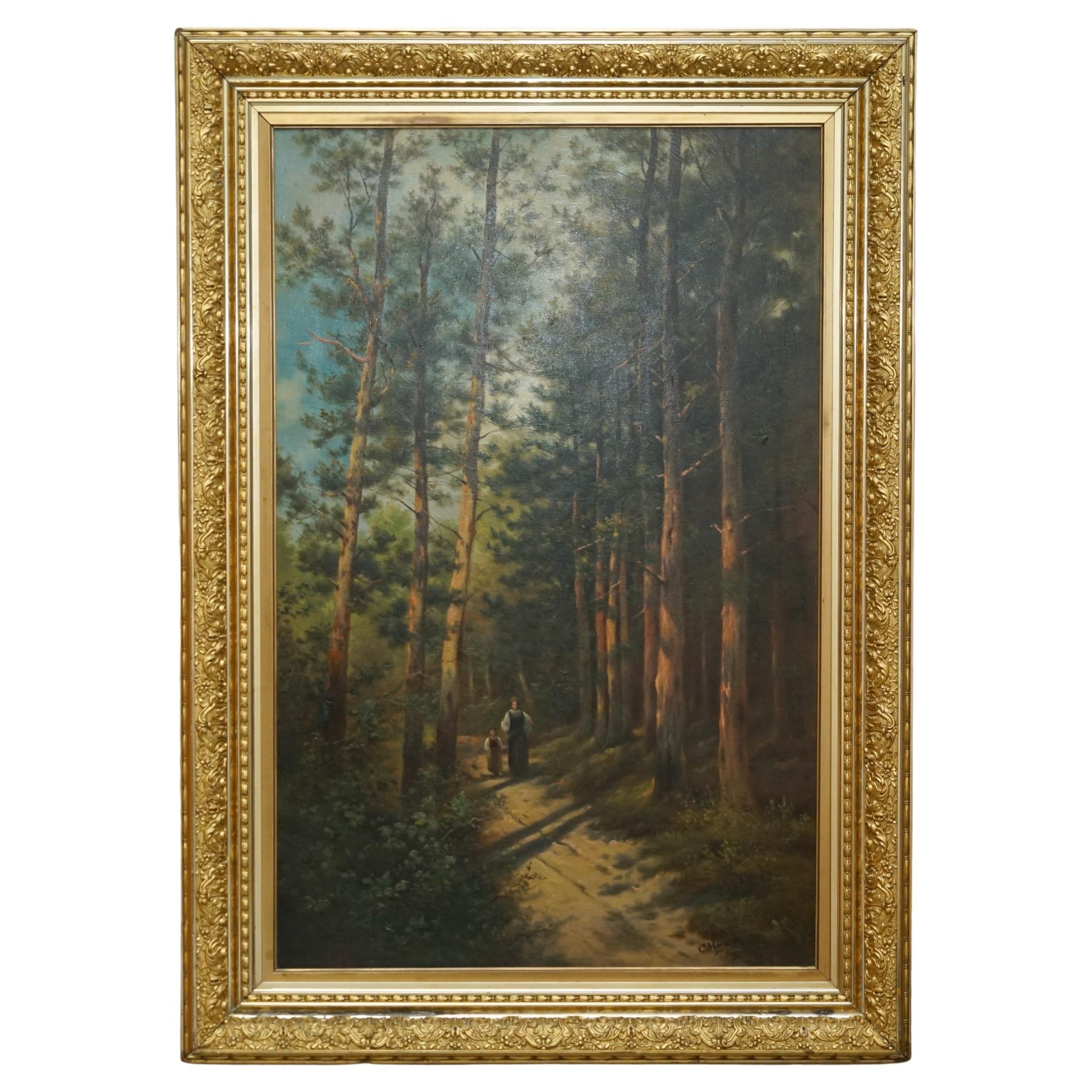 128CM TALL CONTINENTAL PAINTiNG OF A FOREST, MOTHER & DAUGHTER METAL GILT FRAME