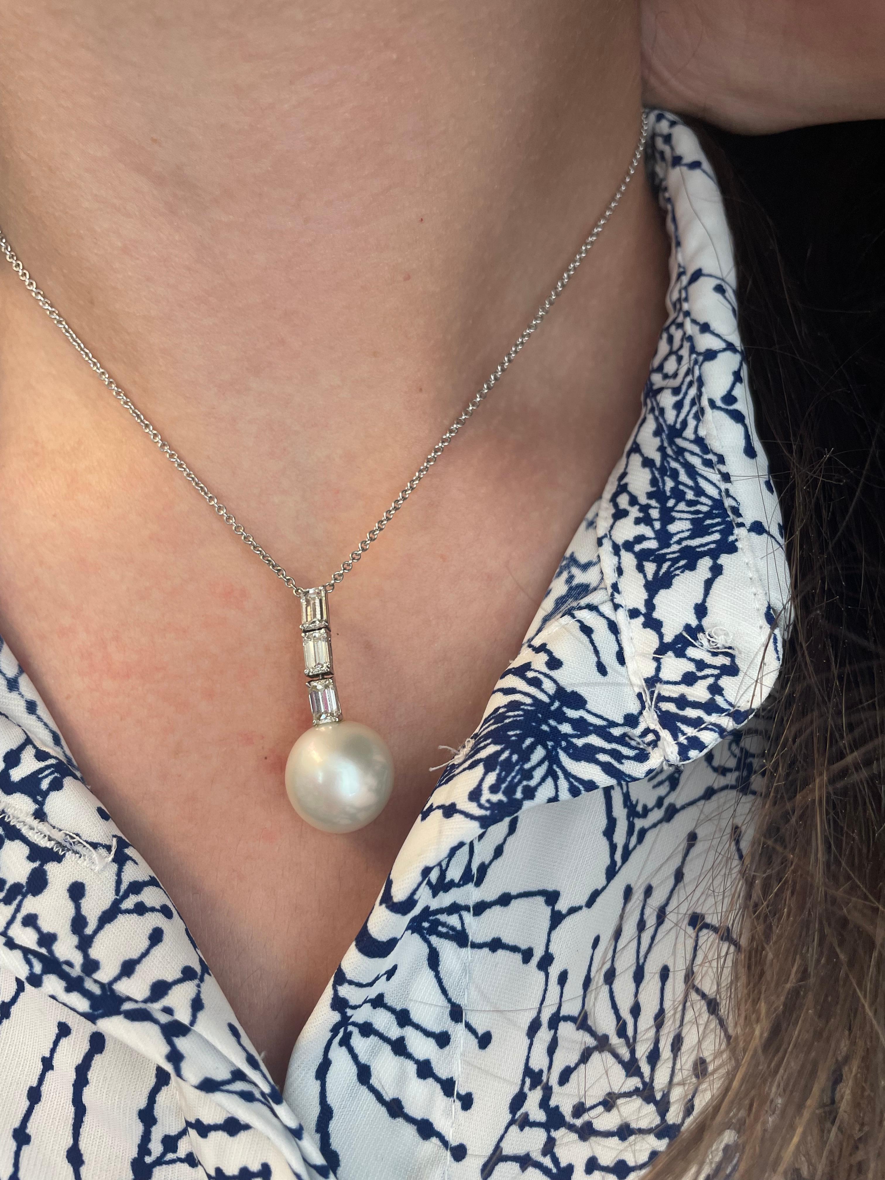 Lovely baguette diamond and pearl pendant necklace.
3 baguette cut diamonds, 1.28ct. Approximately G/H color and SI clarity. 14mm pearl, 18k white gold.
Accommodated with an up to date appraisal by a GIA G.G. upon request. please contact us with any