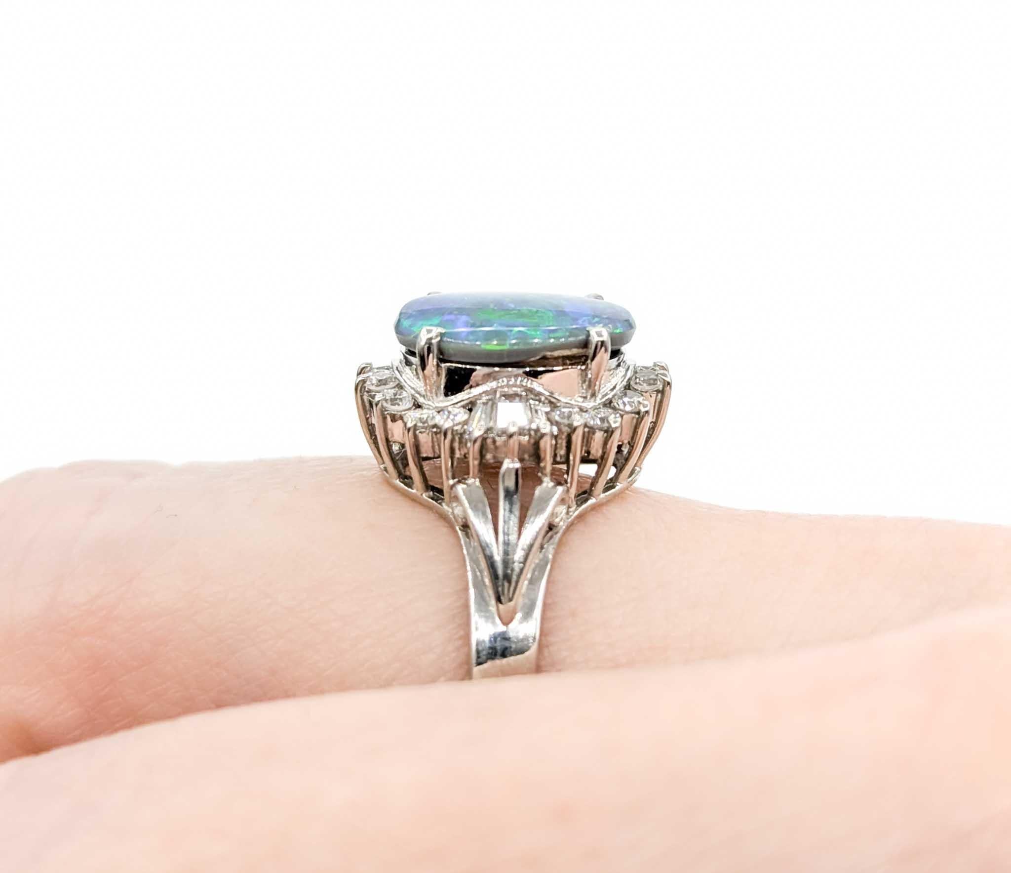 1.28ct Black Opal with Diamond Halo in Platinum

This beautiful opal & diamond ring is beautifully crafted in 900pt platinum. This ring boasts a 1.28ct of black black opal, with a glittering .26ctw Diamond Halo featuring baguette and round diamonds.
