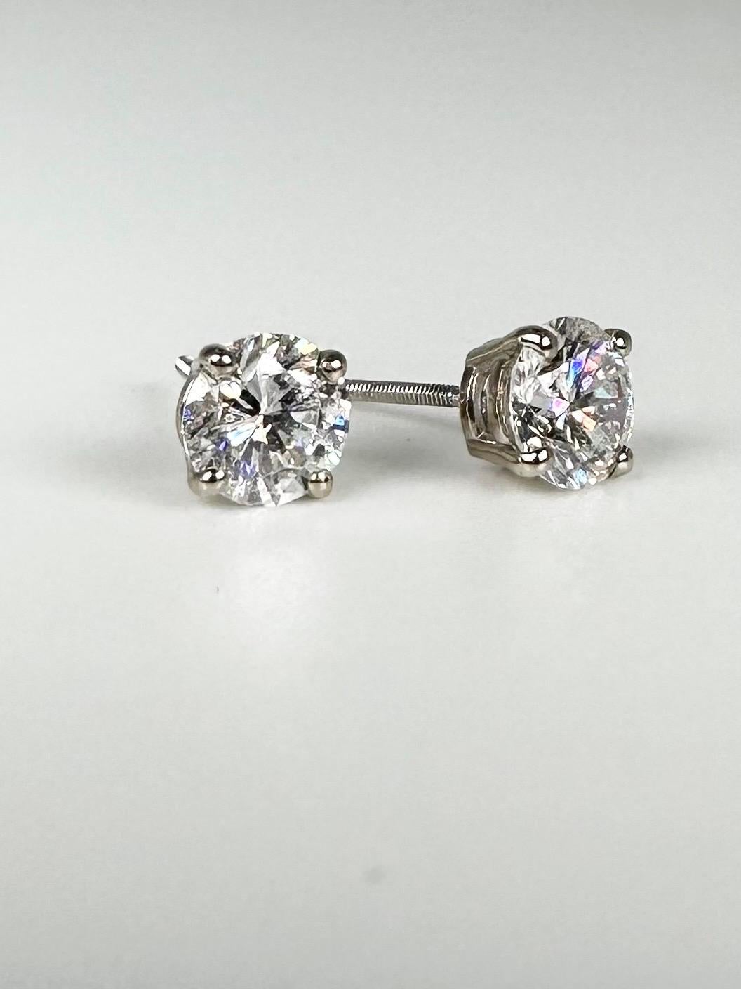 
A pair of sophisticated diamond studs with screw back design for extra security and GIA certificates for piece of mind!

GOLD: 14KT gold
NATURAL DIAMOND(S)
Clarity/Color: VS/F
Carat:1.28ct (GIA certified diamonds)- each earrings is 0.64ct
Cut:Round