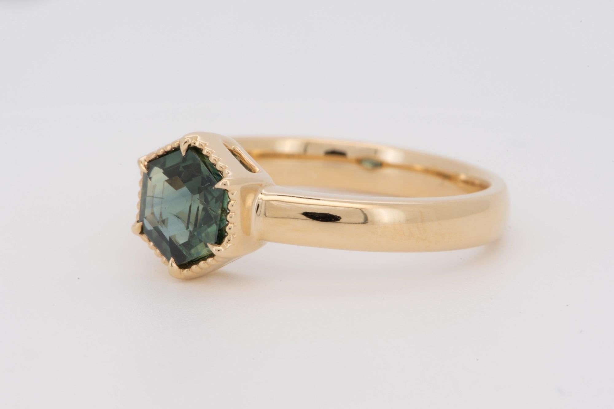 ♥ Solid 14K gold ring set with a hexagon-shaped sapphire with milgrain edges
♥ This item measures 8.2mm in height (North-South direction), 7.3mm in width (East-West direction), and sits 5mm tall from the finger.

♥ Ring size: US Size 7 (Free