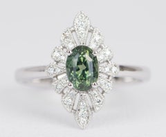 Anello di fidanzamento in oro bianco 14k con zaffiro Montana ovale e diamante aureolato 1,28ct