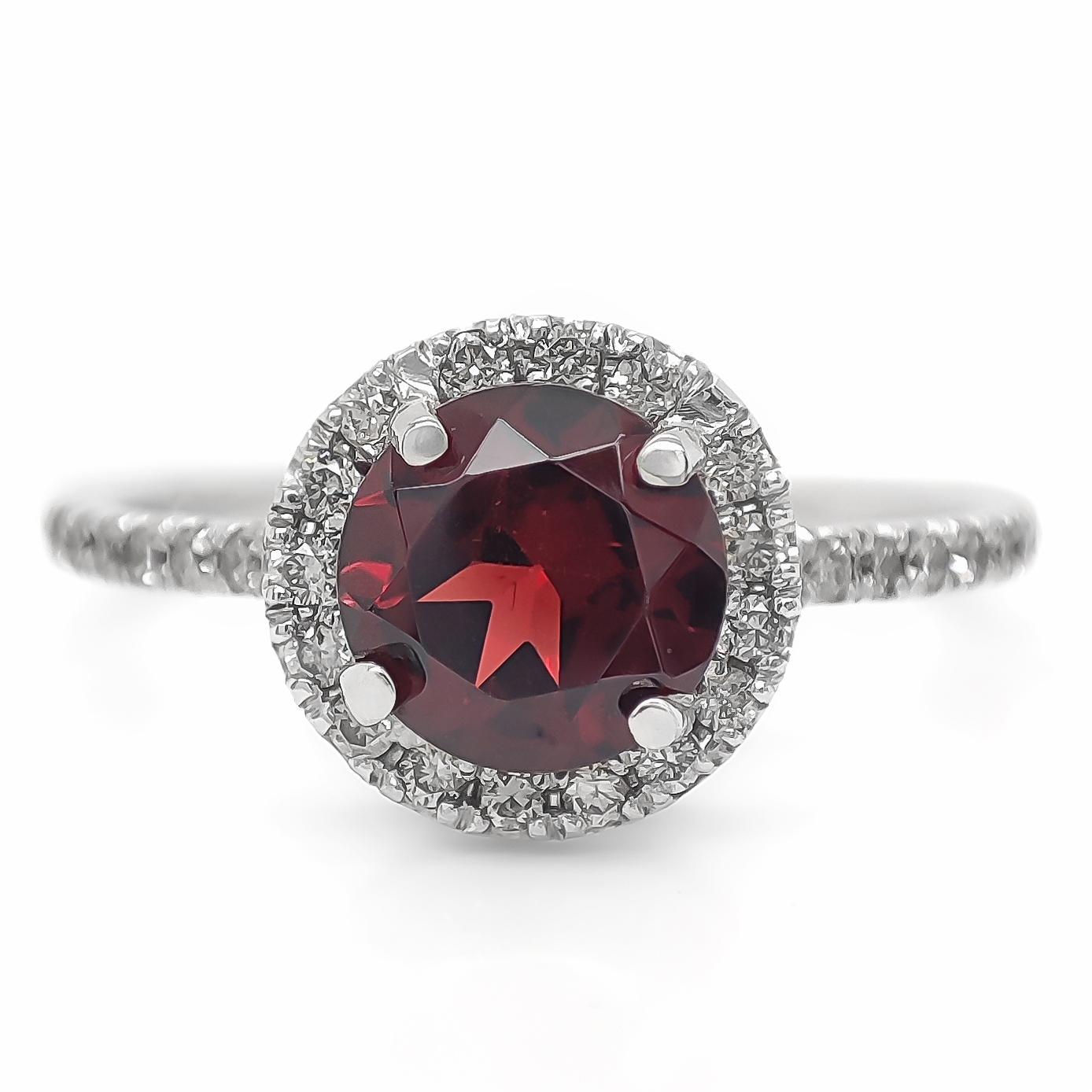 FOR US BUYER NO VAT

This engagement ring is a testament to love and passion. At its heart, it features a captivating 1.10 carat round brilliant red garnet, symbolizing the fiery intensity of your love.

To accentuate the garnet's beauty, the ring
