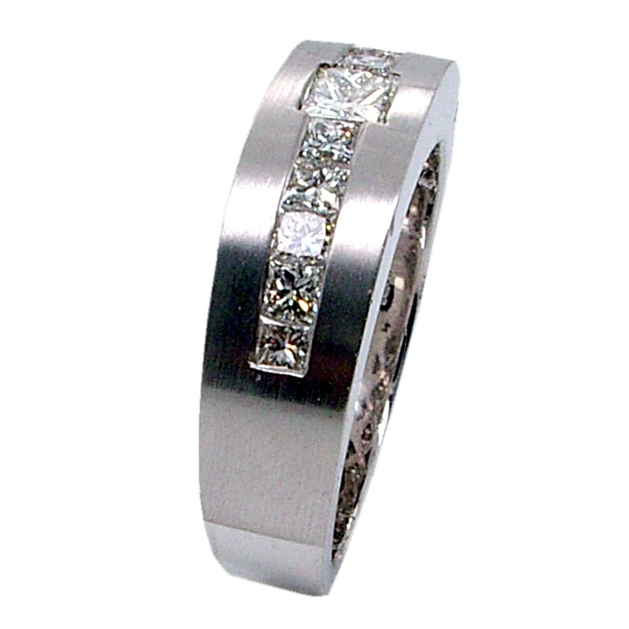 This Beautiful Gent's ring is made in 18K white gold with mat finish top. It has 10 pieces of 2.3 mm and 1 pieces of 4.2 mm Princess Cut Diamonds(Total Weight 1.29 Ct) Channel set on the top. 
Total Diamond Weight: 1.29 Ct VS2-SI1/G-H
Total Weight