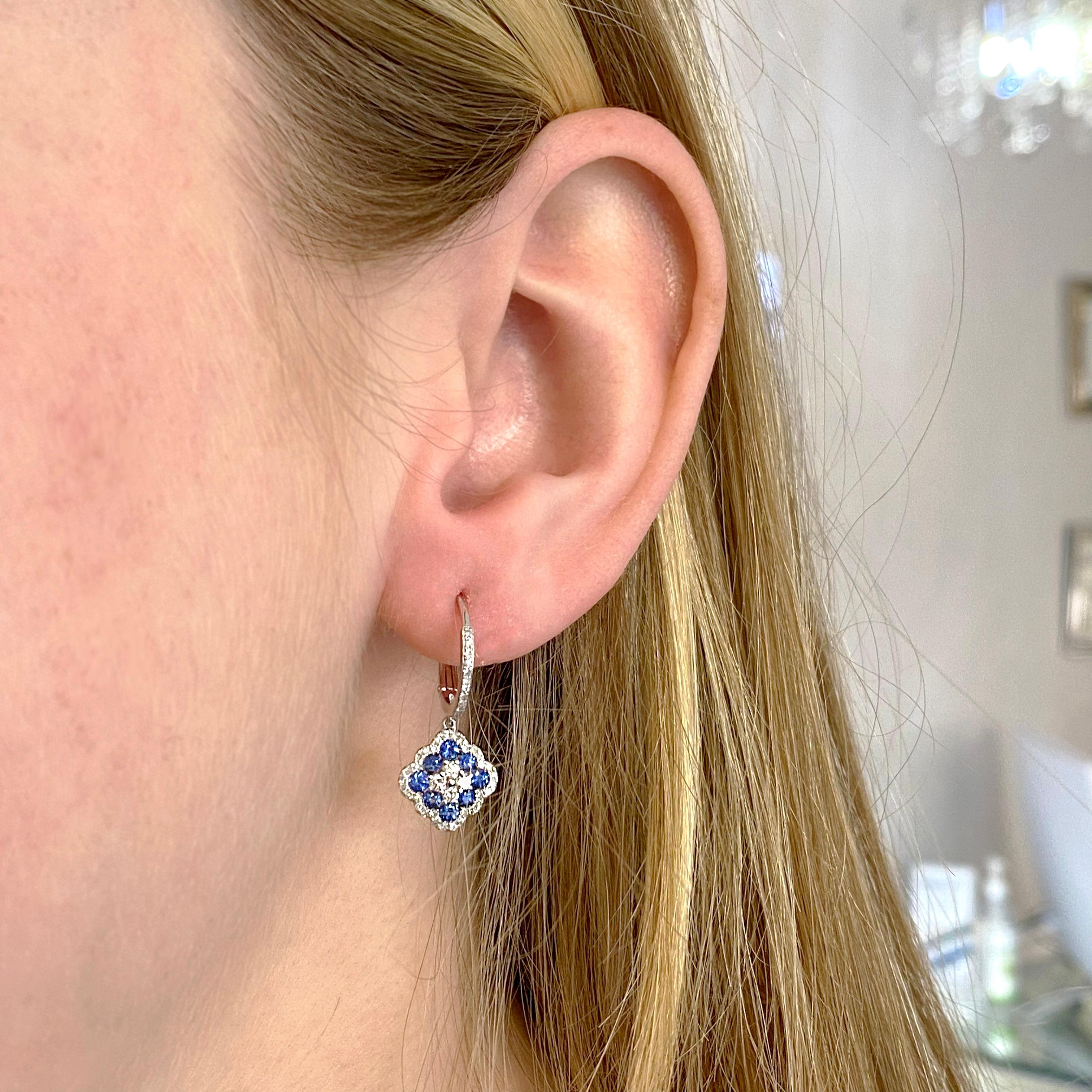 Earrings: 1 Set
Metal Quality: 14 karat White Gold
Earring Type: Dangle
Clasp Type: Lever-Back
Earring Length: 26 millimeters
Earring width: 11 millimeters 
Diamond Number: 98
Diamond Shape: Round
Total Diamond Weight: .47 Carat
Gemstone: