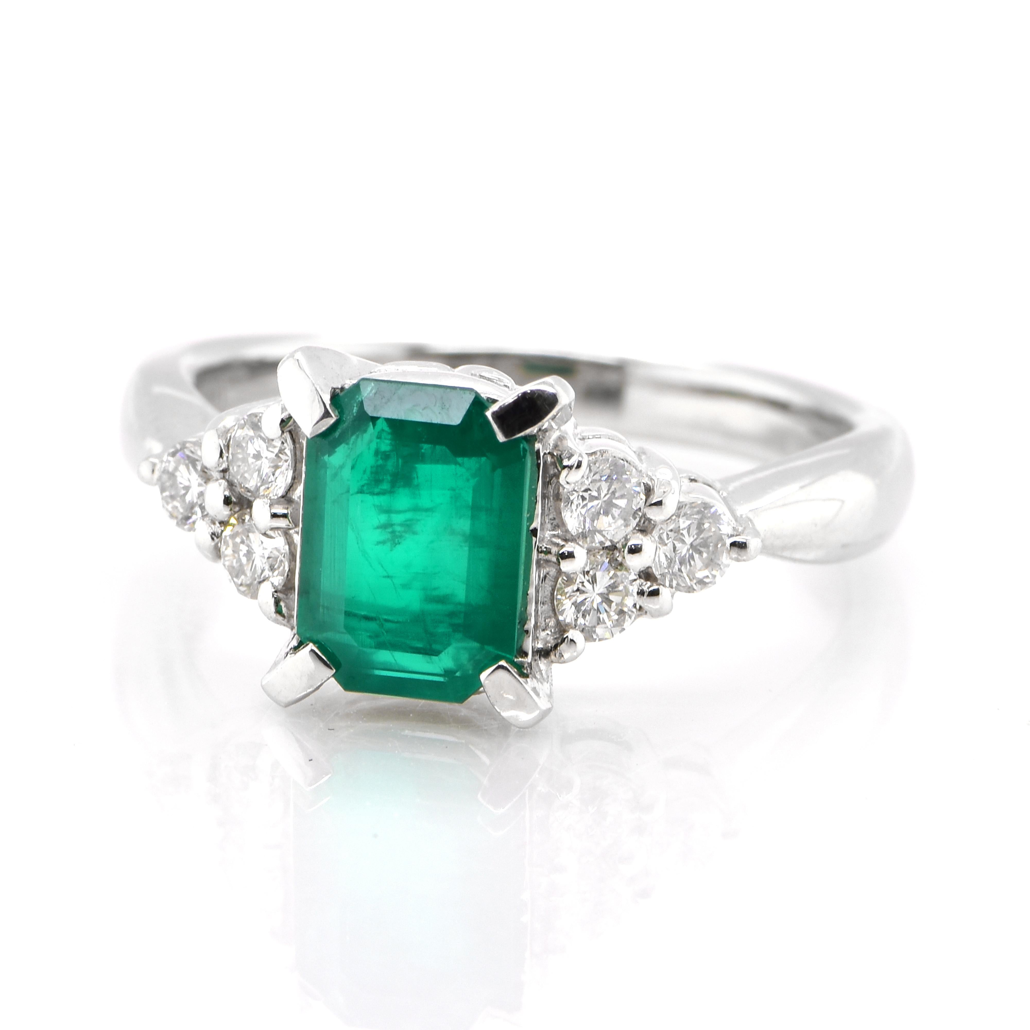 A stunning ring featuring a 1.29 Carat Natural Emerald and 0.324 Carats of Diamond Accents set in Platinum. People have admired emerald’s green for thousands of years. Emeralds have always been associated with the lushest landscapes and the richest