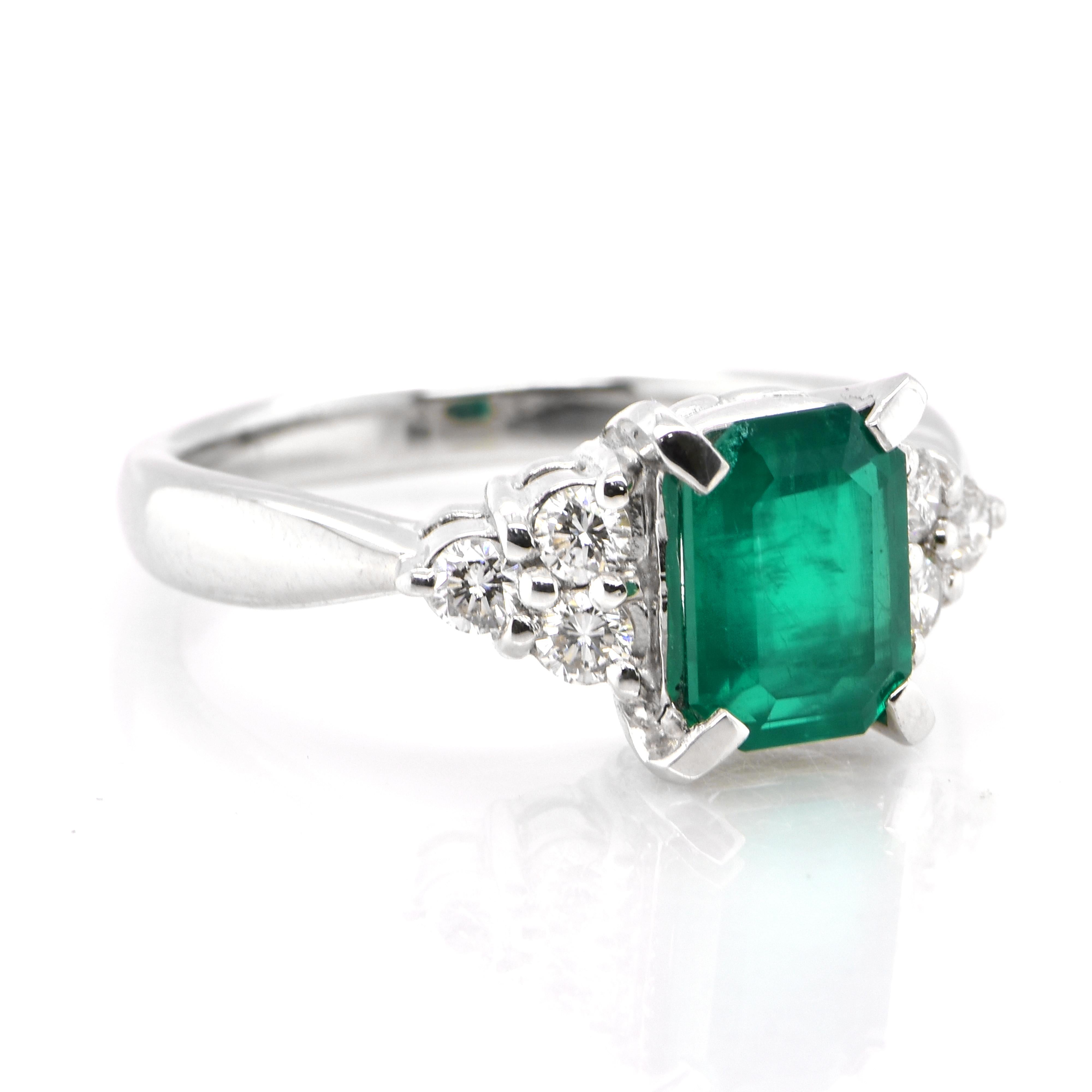 Modern 1.29 Carat Natural Emerald and Diamond Ring Made in Platinum