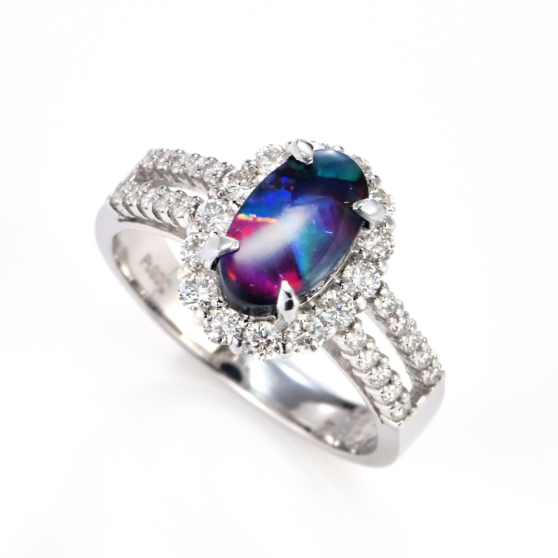 A beautiful ring featuring a 1.294 Carat Australian Black Opal and 0.62 Carat Diamonds made in Platinum. The Opal displays very good play of color! Opals are known for exhibiting flashes of rainbow colors known as 