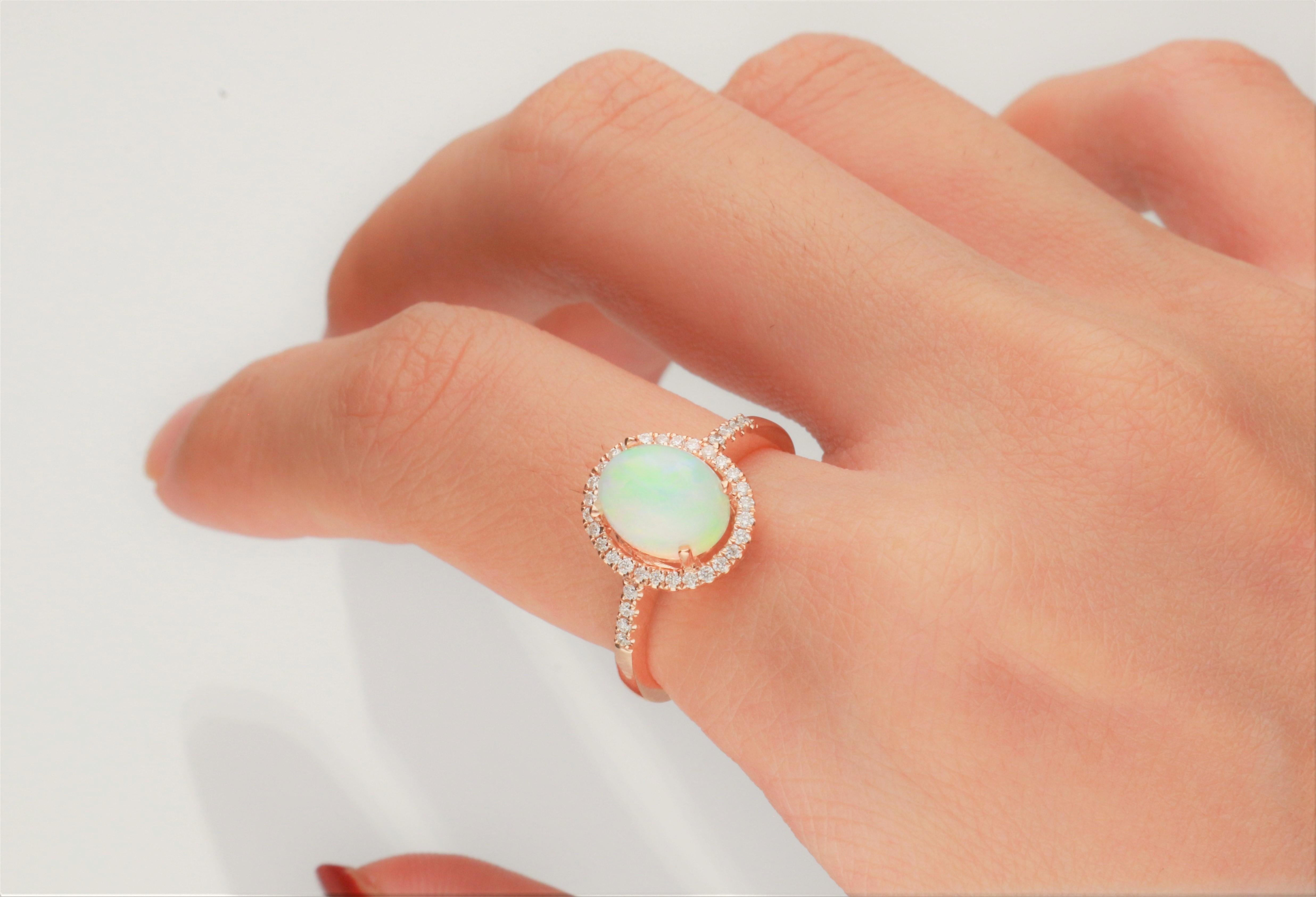 This beautiful Natural Opal Ring is crafted in 14-karat Rose gold and features a 1.29 carat 1 Pc Natural Opal and 36 Pcs Round White Diamonds in GH- I1 quality with 0.18 Ct in a prong-setting. This Ring comes in sizes 6 to 9, and it is a perfect