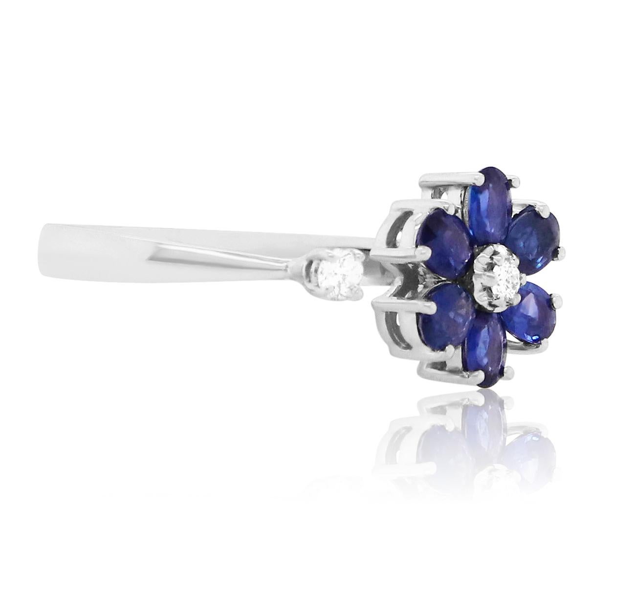 Material: 14k White Gold
Gemstones: 6 Oval Blue Sapphires at 1.29 Carats - Measuring 3 x 4 mm
Diamond Details: 2 Brilliant Round White Diamonds at 0.10 Carats. SI Clarity / H-I Color. 

Fine one-of-a-kind craftsmanship meets incredible quality in