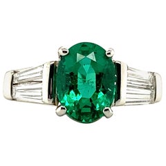 1.29 Carat Oval Emerald and Graduated Baguette Diamond Ring
