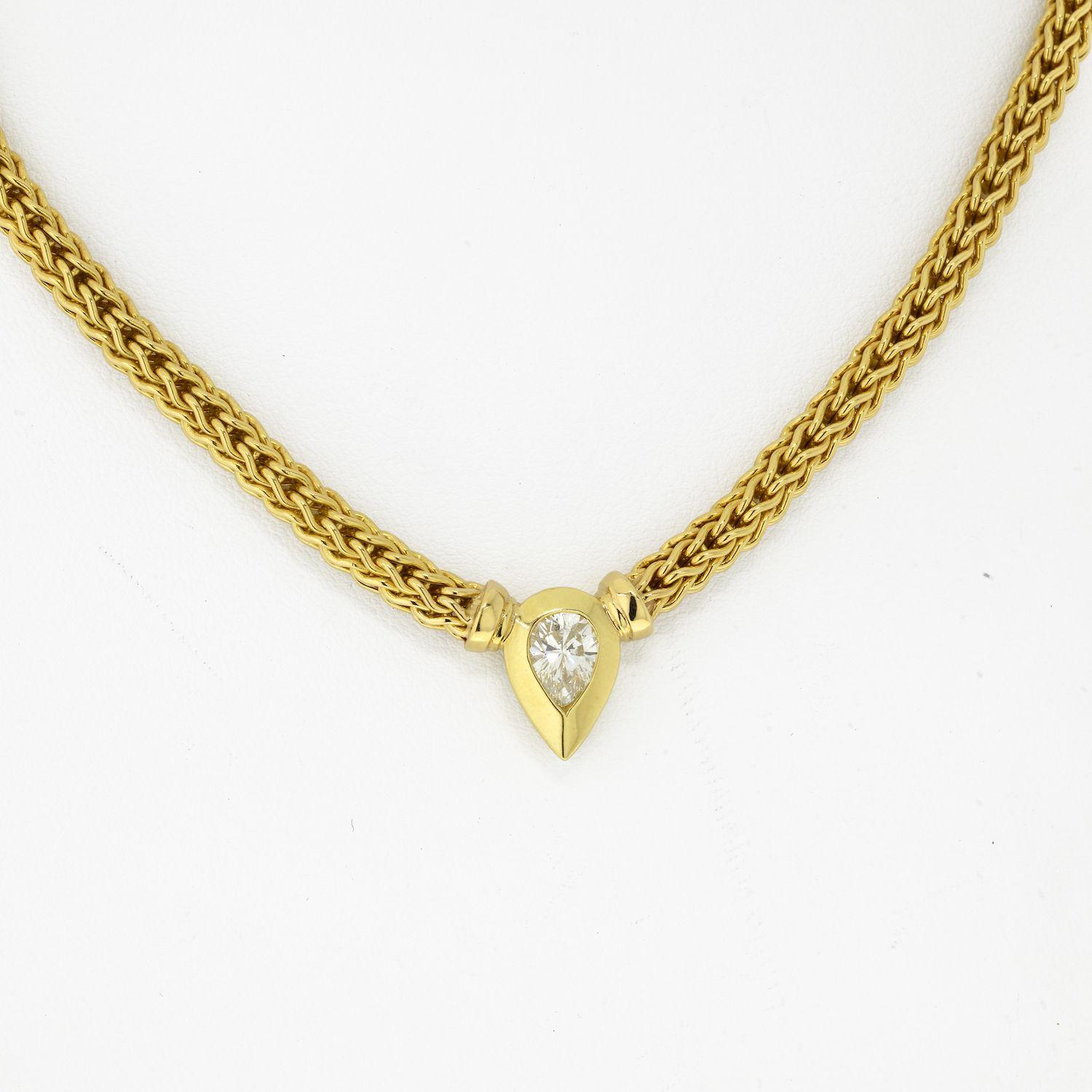 The polishing on this 18k yellow gold Italian basket weave chain is perfect. It feels like silk, it's so smooth and comfortable! 
This chain is 100% Italian 18K pure gold and measures 17 inches long. Lovely pear cut diamond is bezel set as a tear