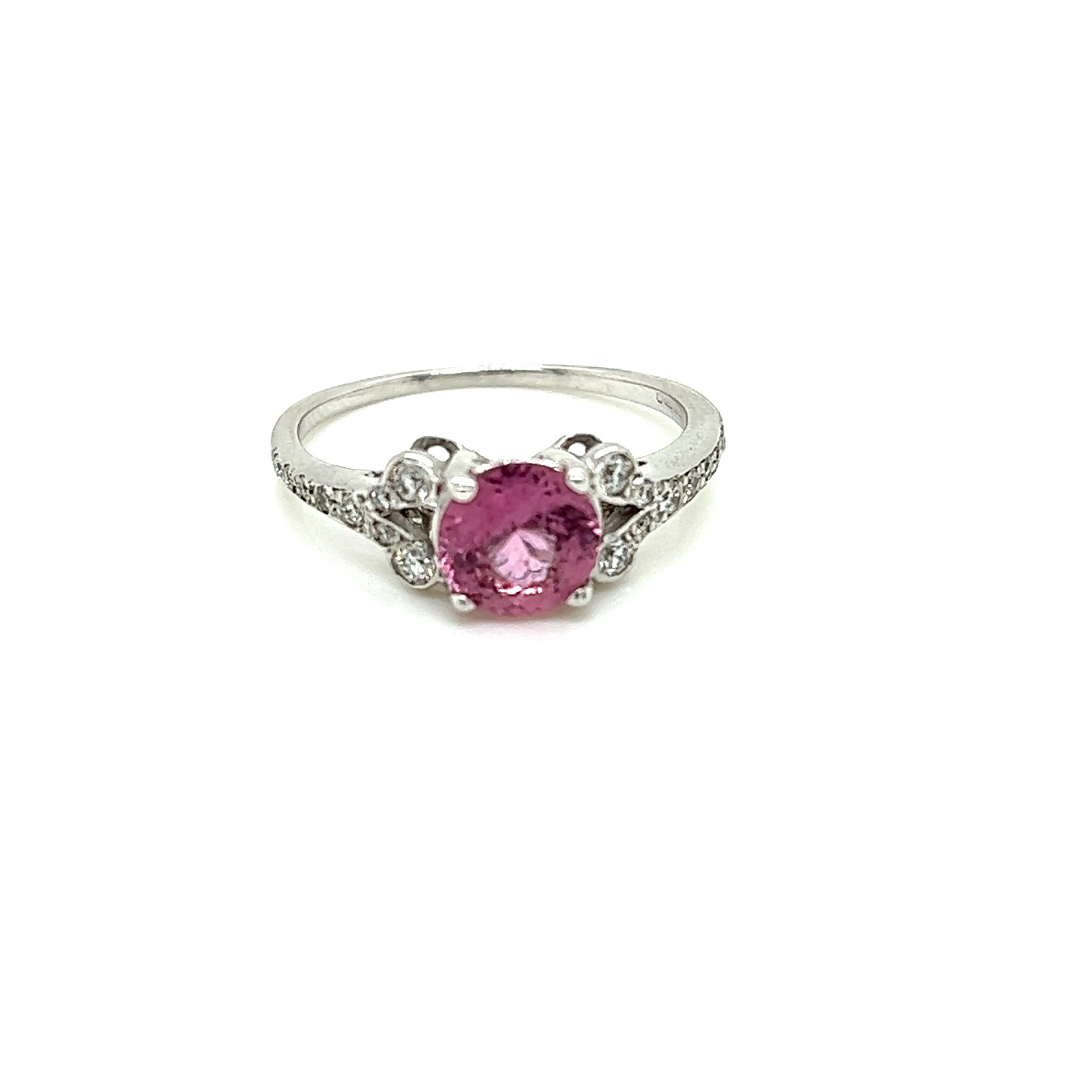 1.29 Carat Round Pink Sapphire and Diamond Ring in 18 Karat White Gold

This graceful ring features a stunning round brilliant Pink Sapphire at its centre. Embedded on the intricate 18K White Gold band it is held on are scintillating round brilliant