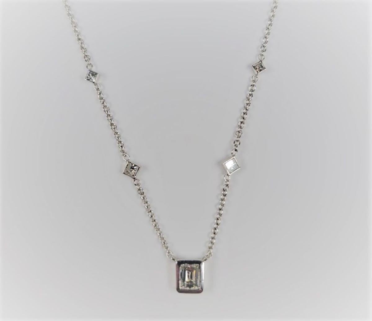 In 14 karat white gold, this beautiful station necklace supports a total of 1.29 carats of bezel-set diamonds. 