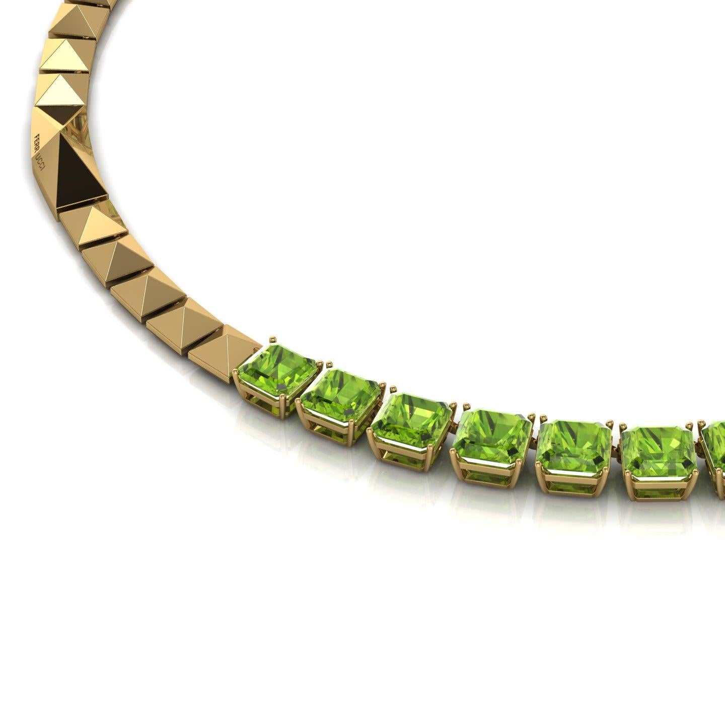 A unique necklaces showcasing approximately 129 carats of natural, eye clean, vivid green Peridots, graduated perfectly to conceived a bespoke necklace in 18k yellow gold with FERRUCCI's signature gold pyramids and a uniquely designed clasp.
The