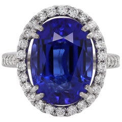 Anillo de cóctel de tanzanita ovalada y diamantes de 12.90 quilates