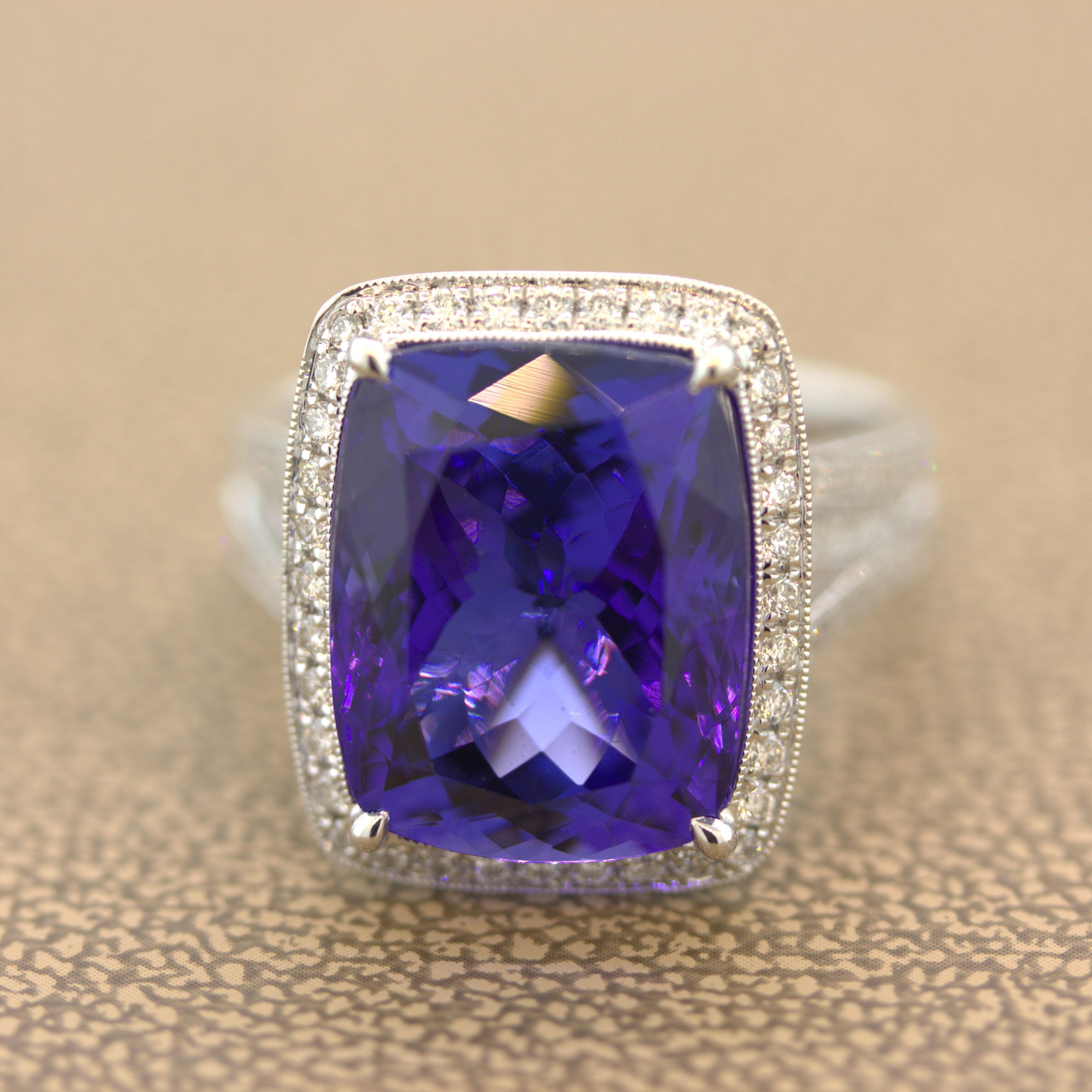 A sweet and savory tanzanite weighing 12.90 carats takes center stage. It has a rich and vibrant purple-blue color and is completely clean with no visible inclusions allowing the stones natural brilliance to shine. It is accented by 0.75 carats of
