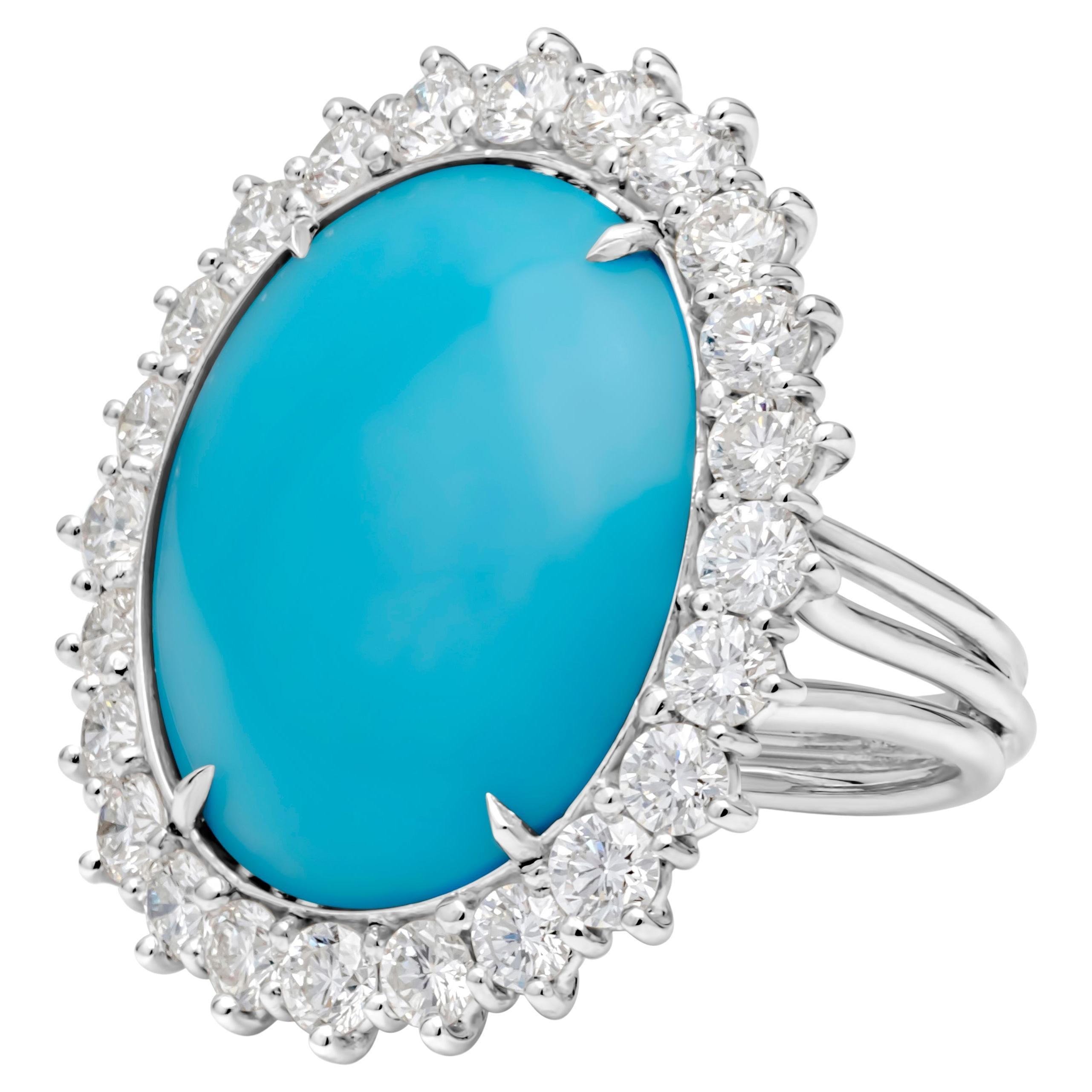 This magnificent and luminous fashion ring showcases 12.90 carats total oval cut blue turquoise gemstone from the sleeping beauty turquoise mine(one of the most well known producers of turquoise in the world), set in a classic four prong basket