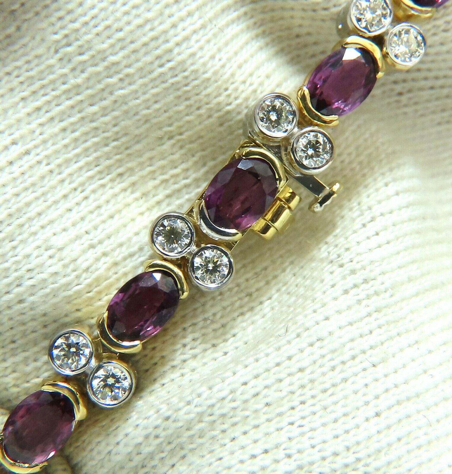 Ruby Diamond Durable Link.

10.80ct Natural Ruby bracelet.

Ovals Full Cut brilliants, transparent & clean clarity.

Bright purple pink colors.

 Average 4x5mm each.

Round full cut natural Diamonds: 2.10ct. 

I color, Vs-2 clarity.

14kt. yellow