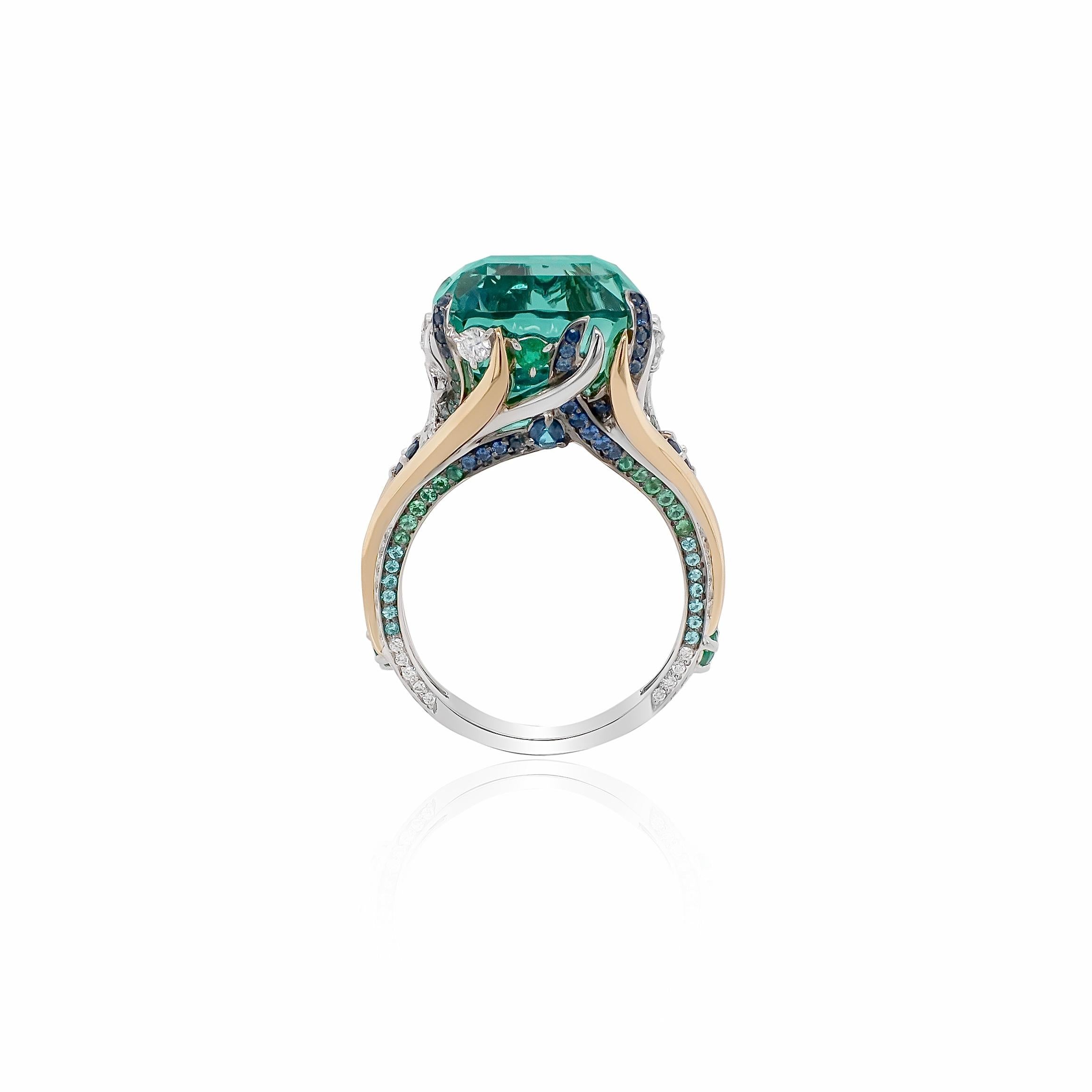 This breathtaking one-of-a-kind ring features an exceptionally rare 12.920 carat Lagoon Tourmaline, a piece of jewellery that took over a year to source and create. Beginning with a rough stone of unparalleled beauty, it was expertly cut by master