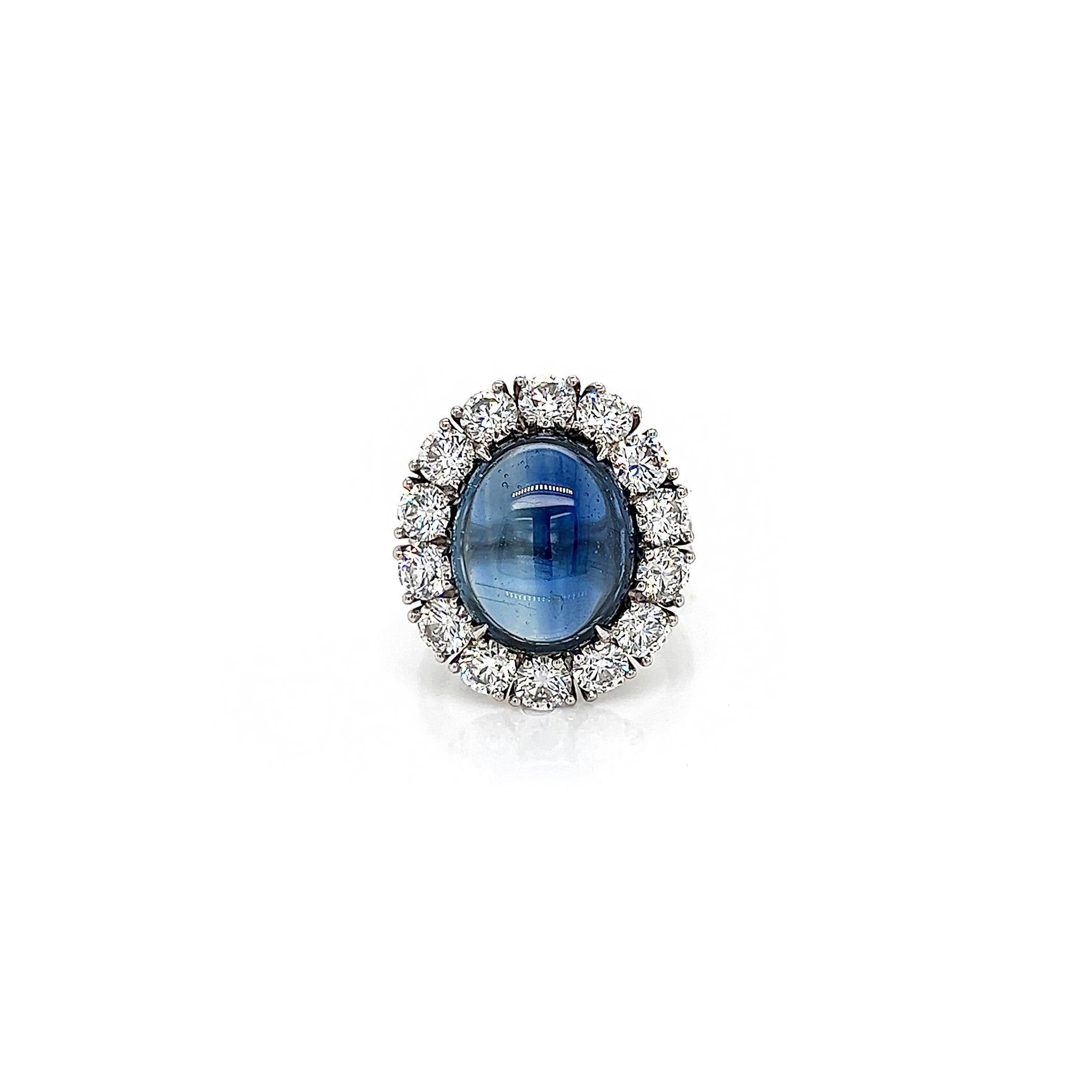12.92 Total Carat NO HEAT Sapphire and Diamond Halo Pave-Set Ladies Ring. GIA Certified

Distinctly glamorous, this sapphire and diamond ring showcases a 9.77 Carat deep blue UNHEATED natural sapphire. The mesmerizing 9.77 Carat Sapphire offers so