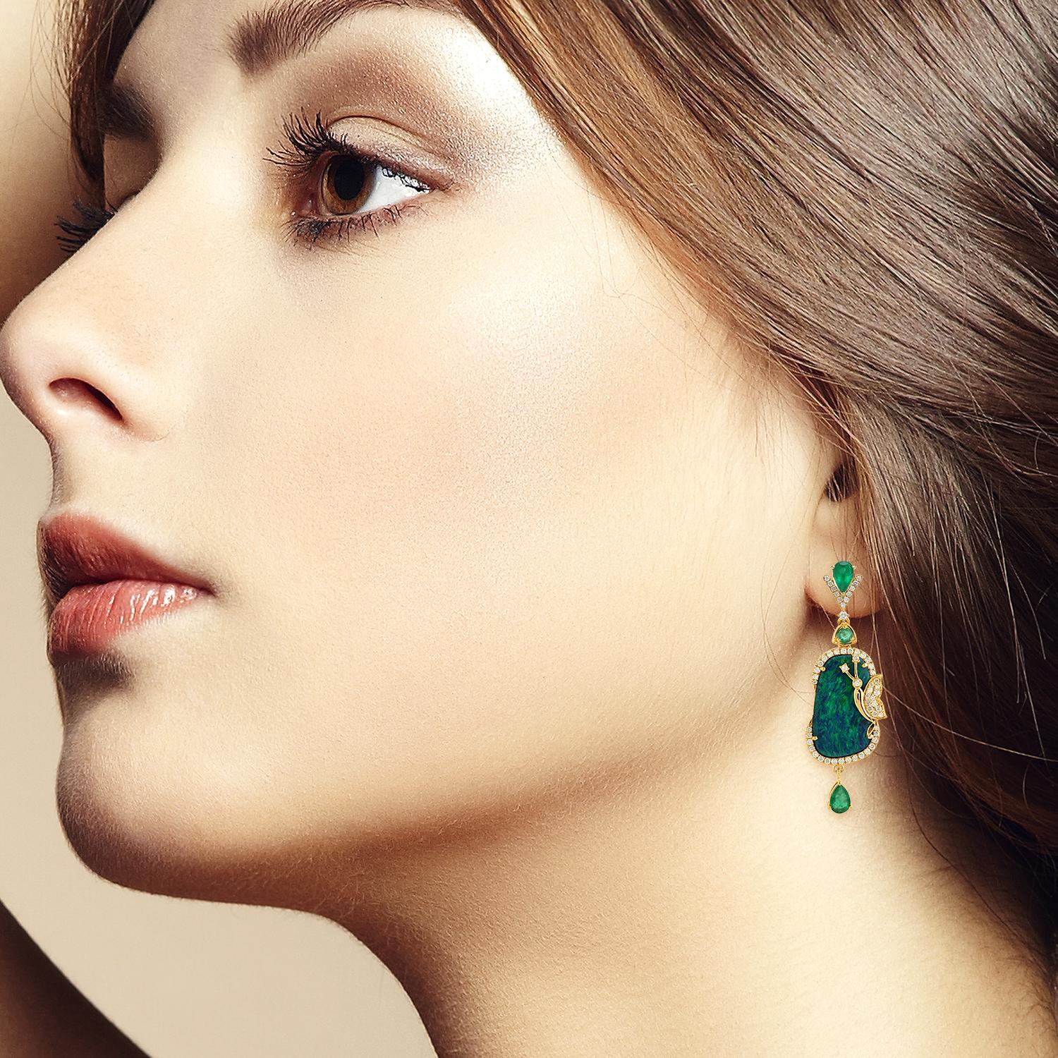 Cast from 18-karat gold, these exquisite drop earrings are hand set with 12.93 carats Opal, 1.79 carats emerald and .88 carats of glimmering diamonds. 

FOLLOW  MEGHNA JEWELS storefront to view the latest collection & exclusive pieces.  Meghna