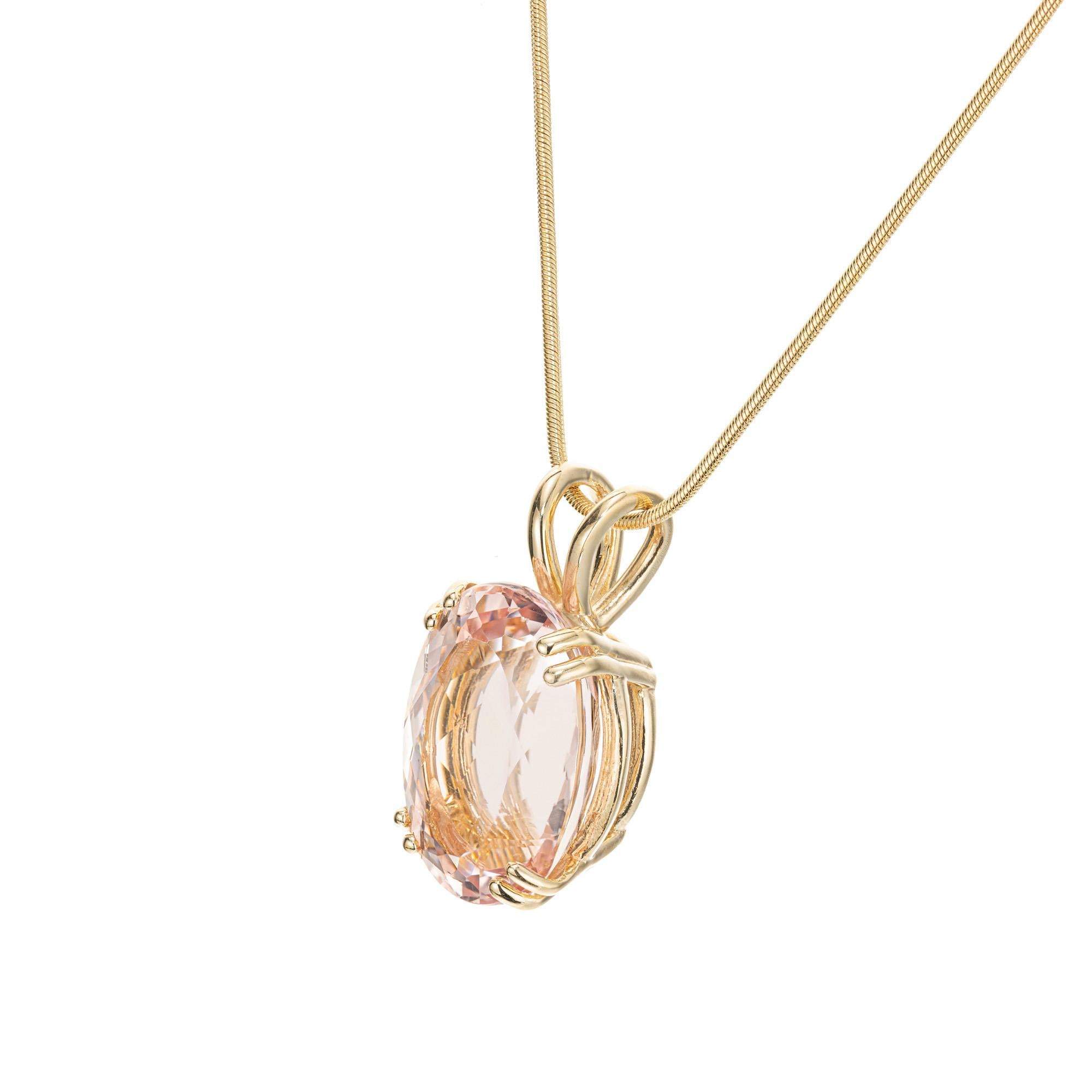 Morganite and diamond pendant necklace. Oval 12.95ct oval soft pink morganite in a 14k yellow gold double prong setting. 16 inch yellow gold chain.  

1 oval pink morganite, VS approx. 12.95cts
14k yellow gold 
Stamped: 585
9.6 grams
Top to bottom: