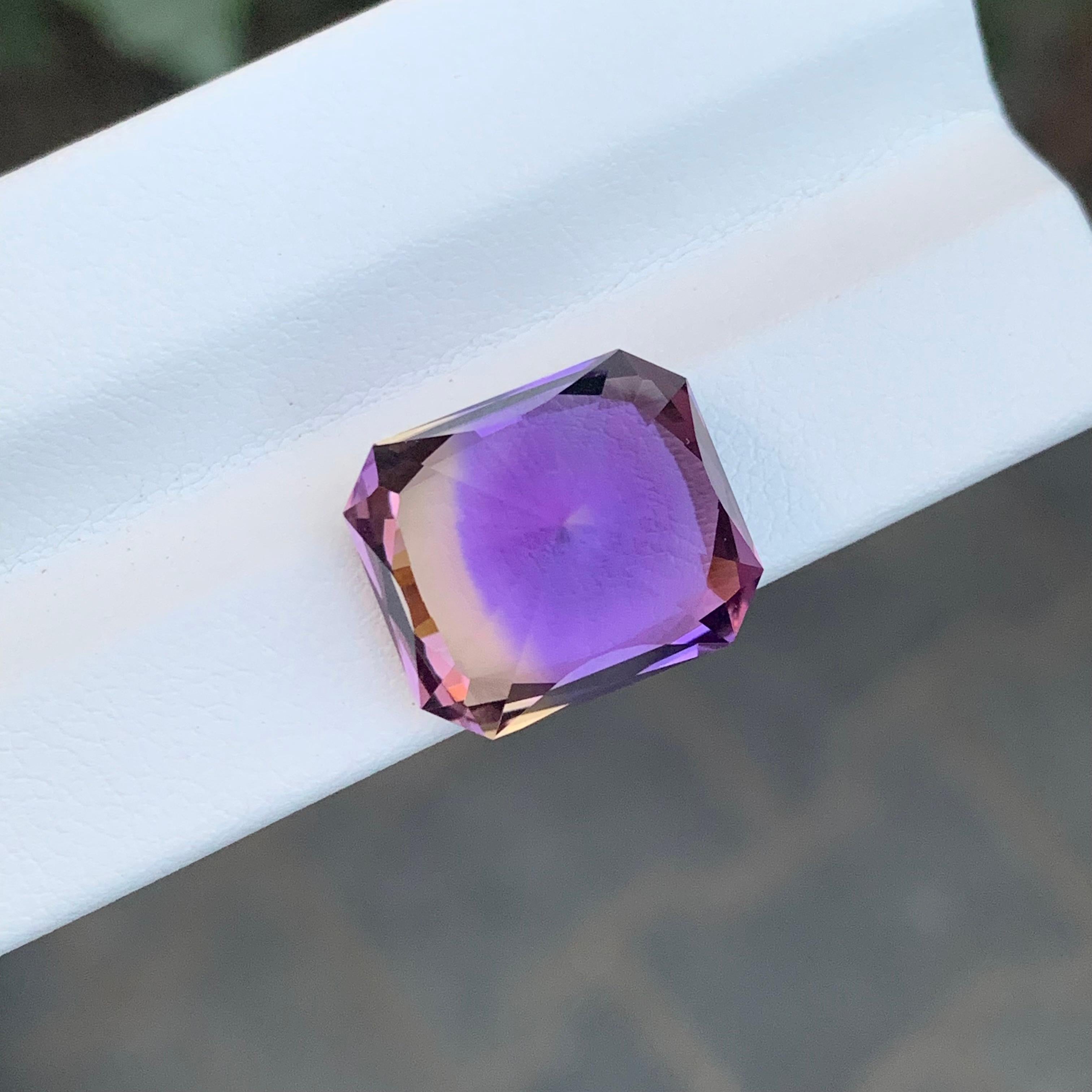 Faceted Ametrine

Weight: 12.95 Carats
Dimension; 15.3 x 13.1 x 11 Mm
Origin: Brazil
Color: Purple & Yellow
Shape: Emerald
Treatment: Non
Certficate: On Demand
.
Ametrine is a unique and captivating gemstone that displays a harmonious blend of two