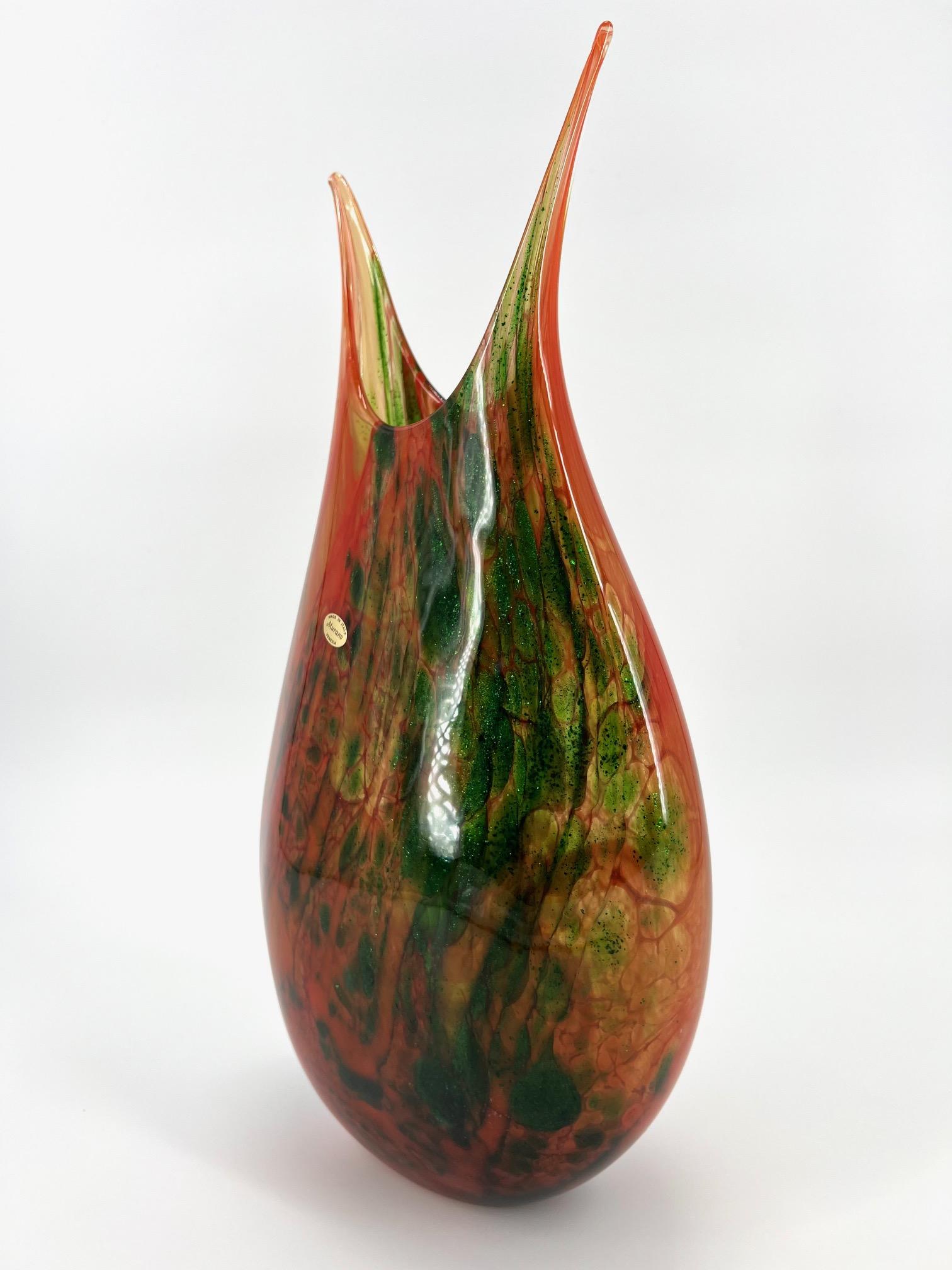Our main goal is to evoke emotions through the creation of unique and stunning Murano glass art pieces. This art-vase, in particular, is a testament to the creativity and skill of our Master Glassblowers. It is beautifully handcrafted using