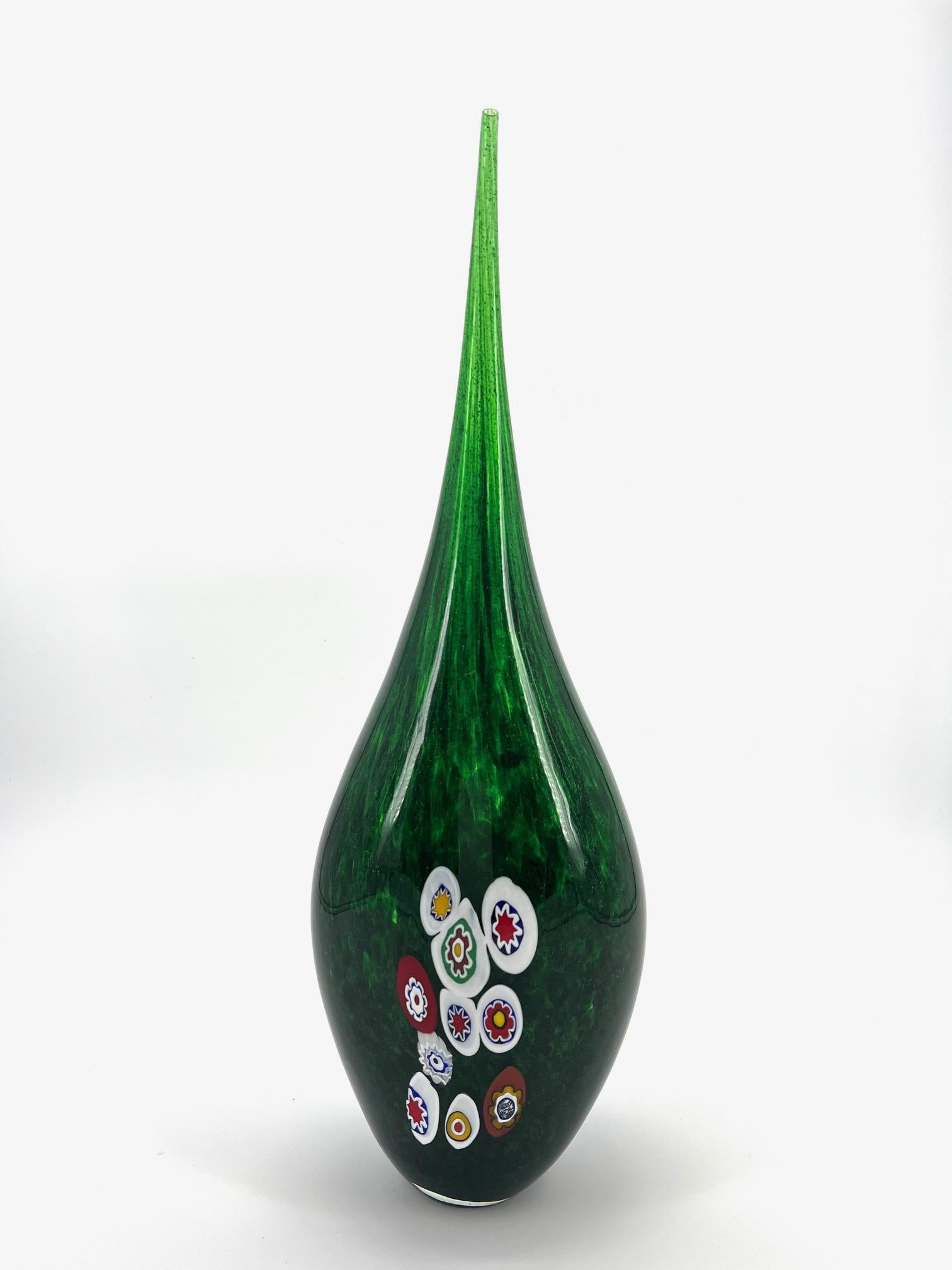 Our aim is the emotion through the creation of Murano glass artpieces.
 
This art-vase is made of Rare and Beautiful green Avventurina, that gives to this artpiece an amazing reflex, Murano multicolour Murrine complete the masterpiece.
it's made