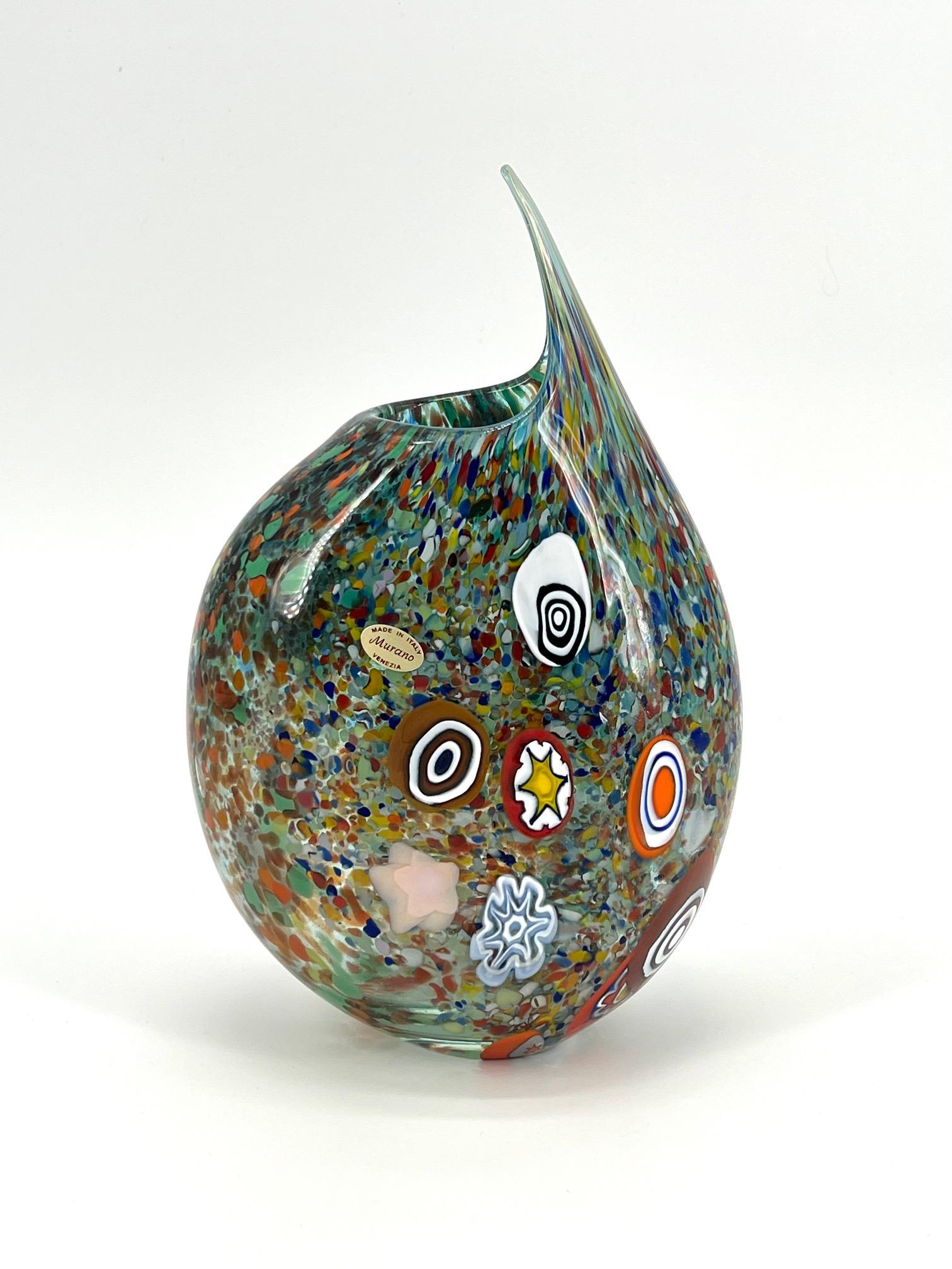 Our aim is the emotion through the creation of Murano glass artpieces.
 
This art-vase is hand made in our Murano workshop, our Master blowns glass in multicolour Murrine to gives to the artpiece nice colours, details and a contemporary