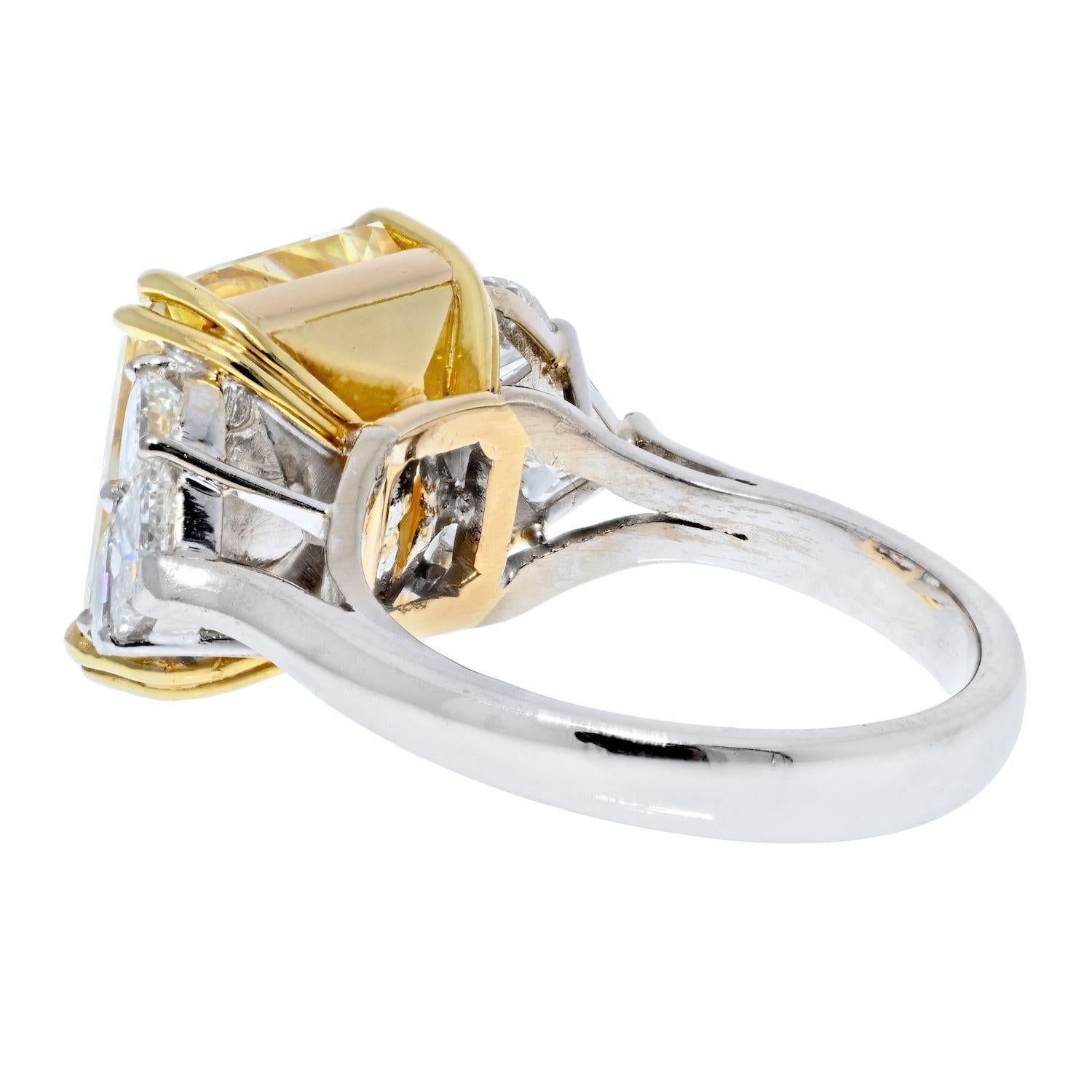 This is a stunning 12.96 carat natural fancy yellow radiant cut diamond that is just four points shy of 13 carats. Grand look on your finger that this center diamond delivers will knock your socks off! Also with a touch of shimmering white diamonds