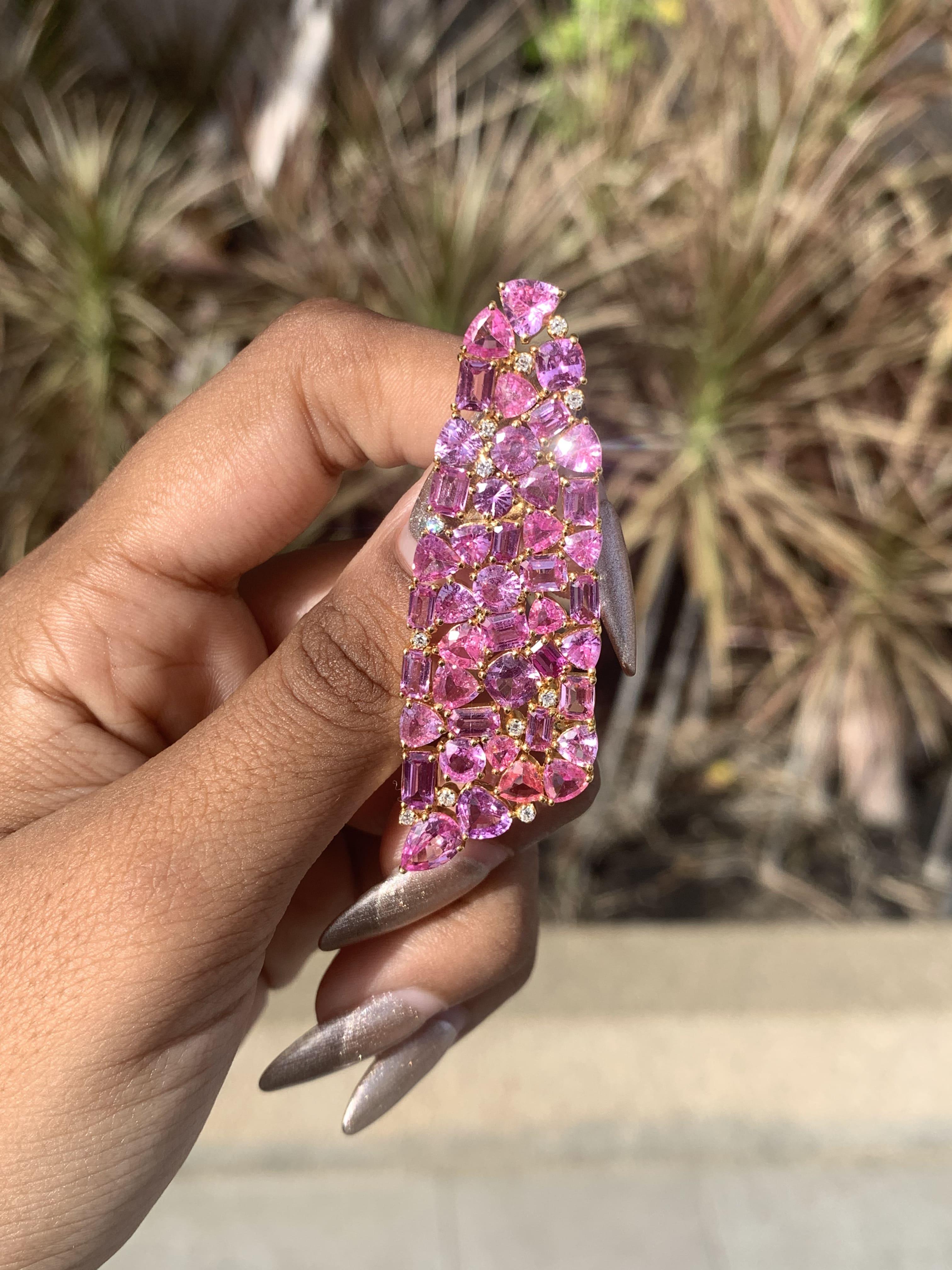 With its exceptional design and a symphony of mesmerizing pink hues, this one-of-a-kind jewelry piece is destined to leave you spellbound.

The brooch features stunning 12.97-carat pink sapphires, meticulously handpicked for their exceptional color