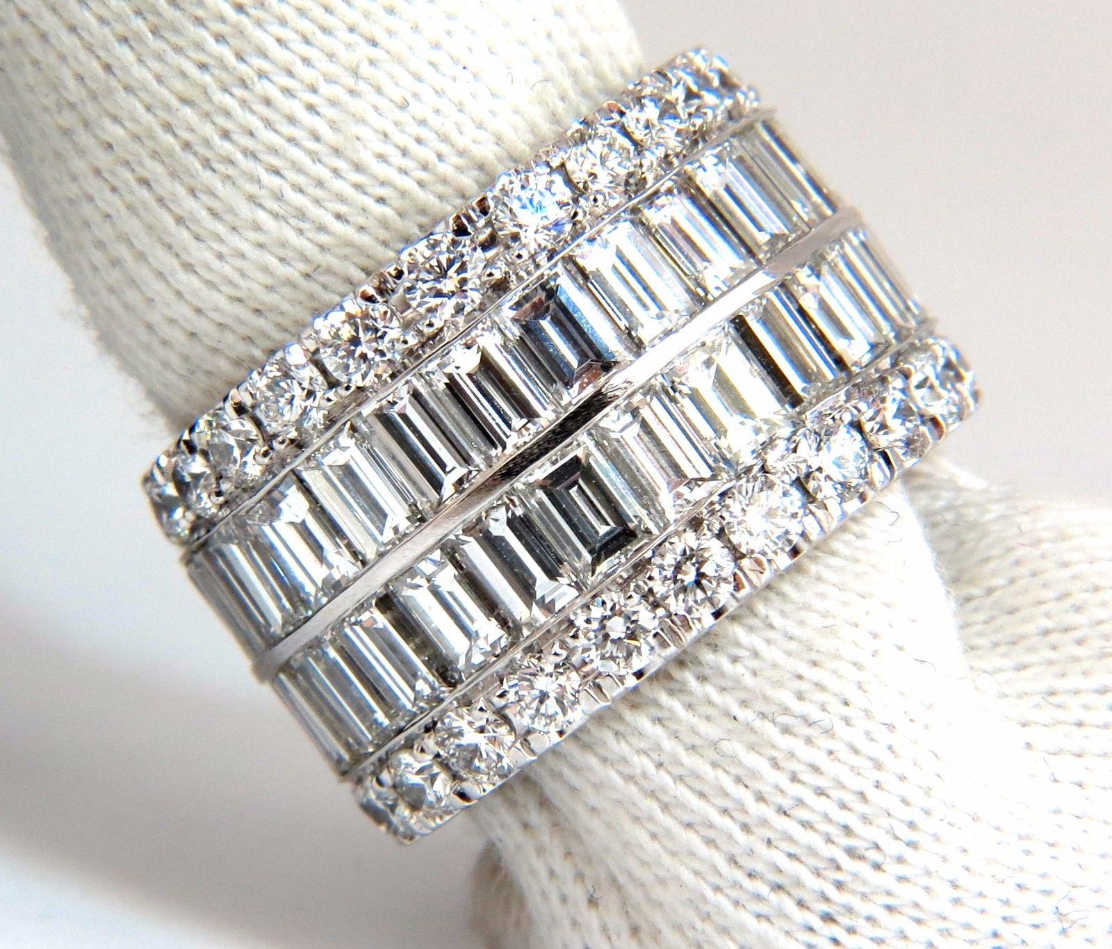 Eternity Revolver

12.98ct. Diamonds eternity Ring
Natural Baguette & Round Cuts

(10.24ct Baguettes & 2.74ct Rounds)

E.F color 

Vs-1 Vs-2 clarity

Size 6.75 / 7


Ring:

13.8mm wide

3mm depth


18kt. white gold

 $75,000 Appraisal to